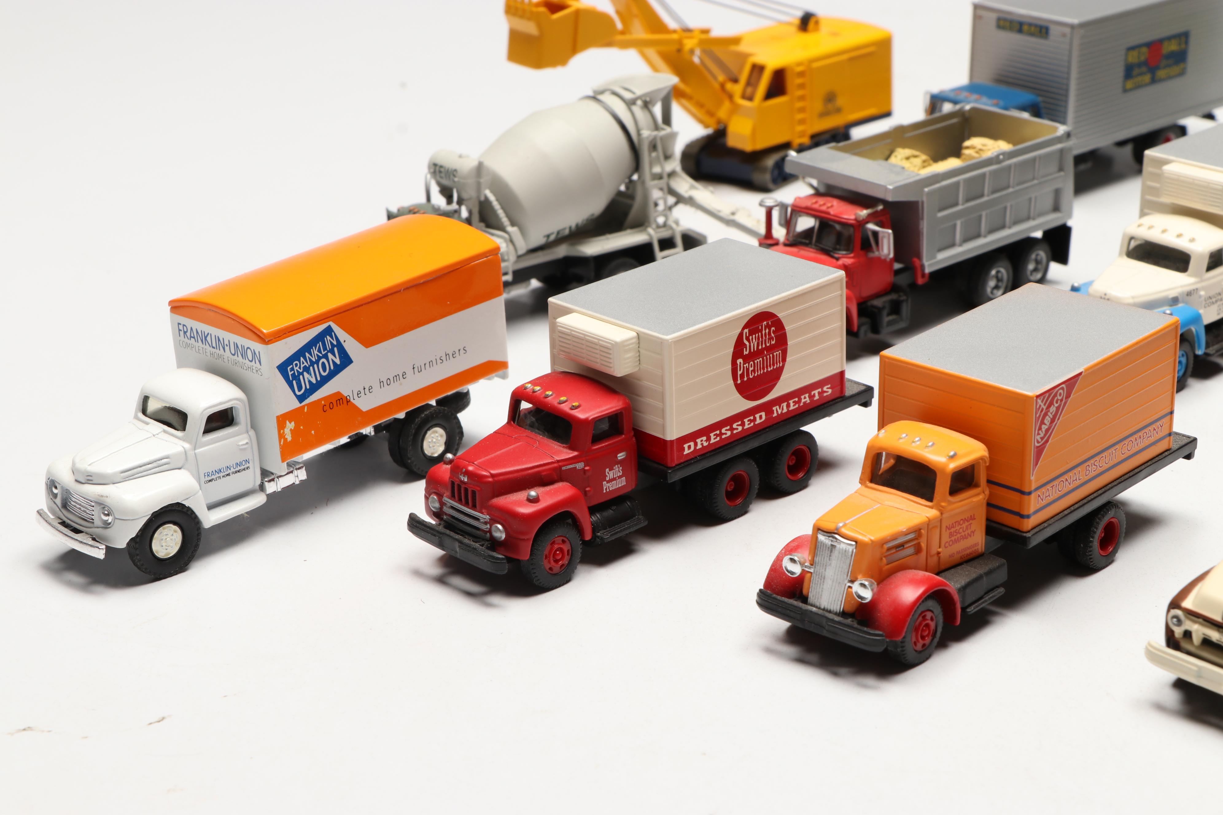 Golden, CMW with Other Train Prop Trucks and Bus