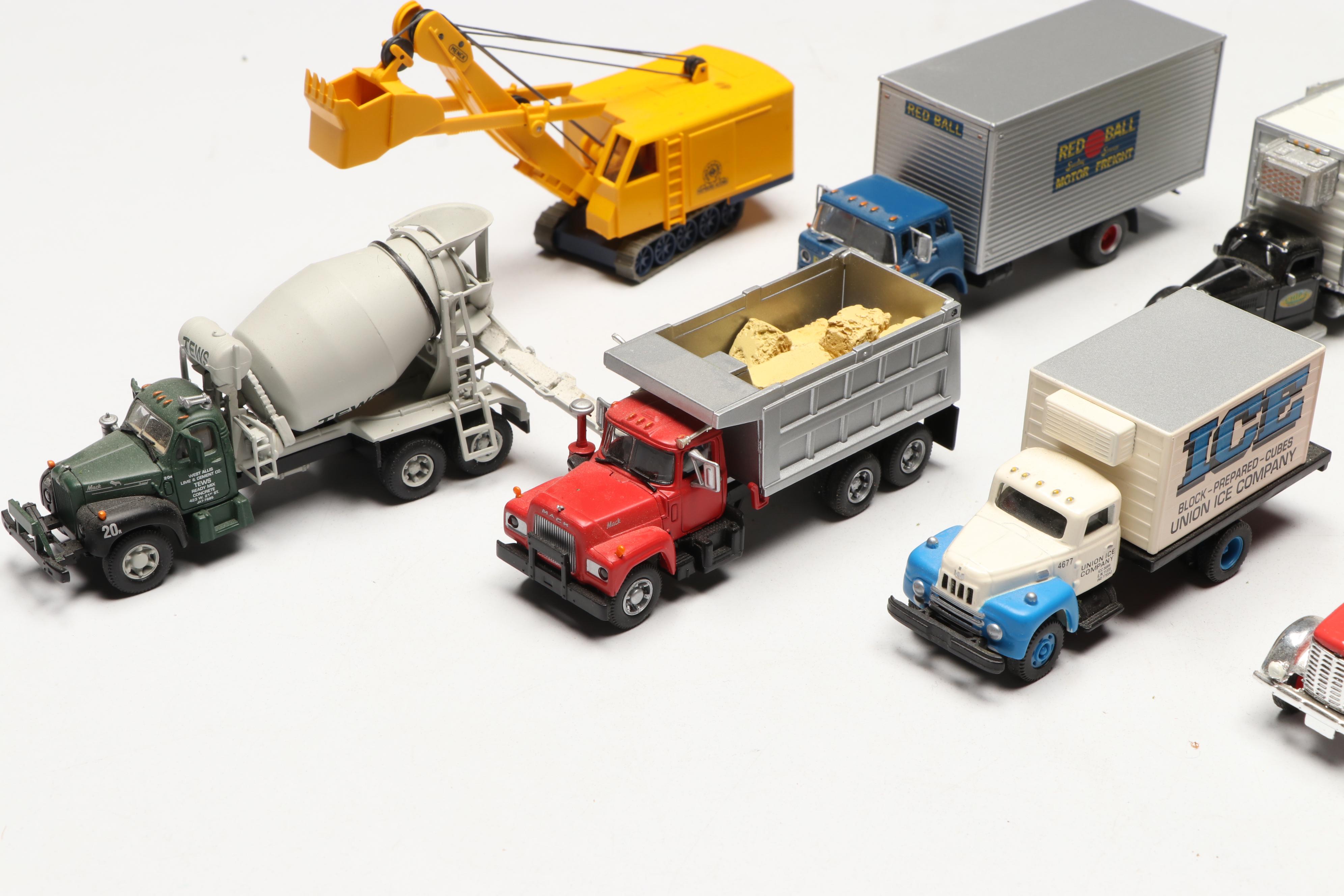 Golden, CMW with Other Train Prop Trucks and Bus