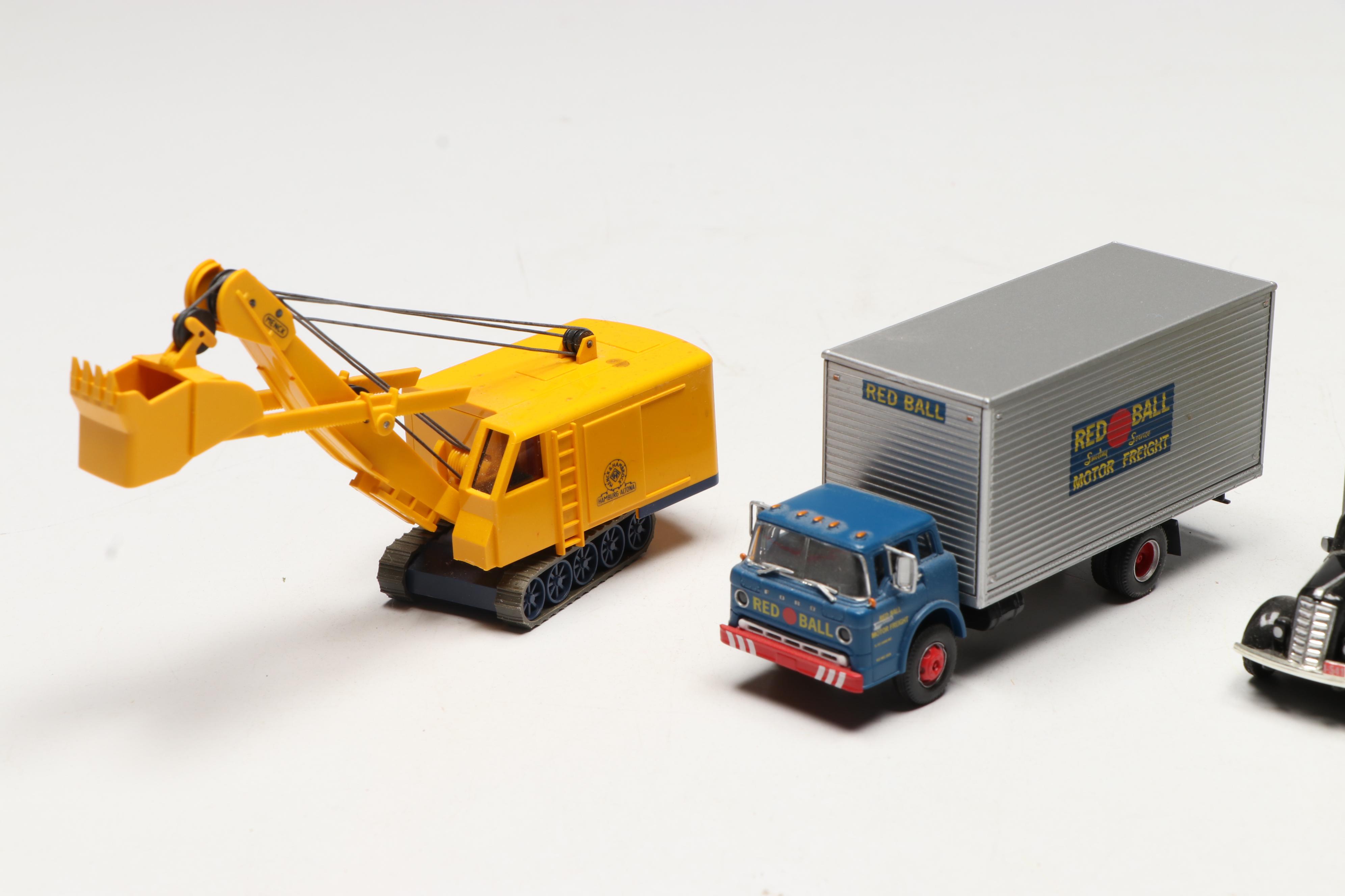 Golden, CMW with Other Train Prop Trucks and Bus