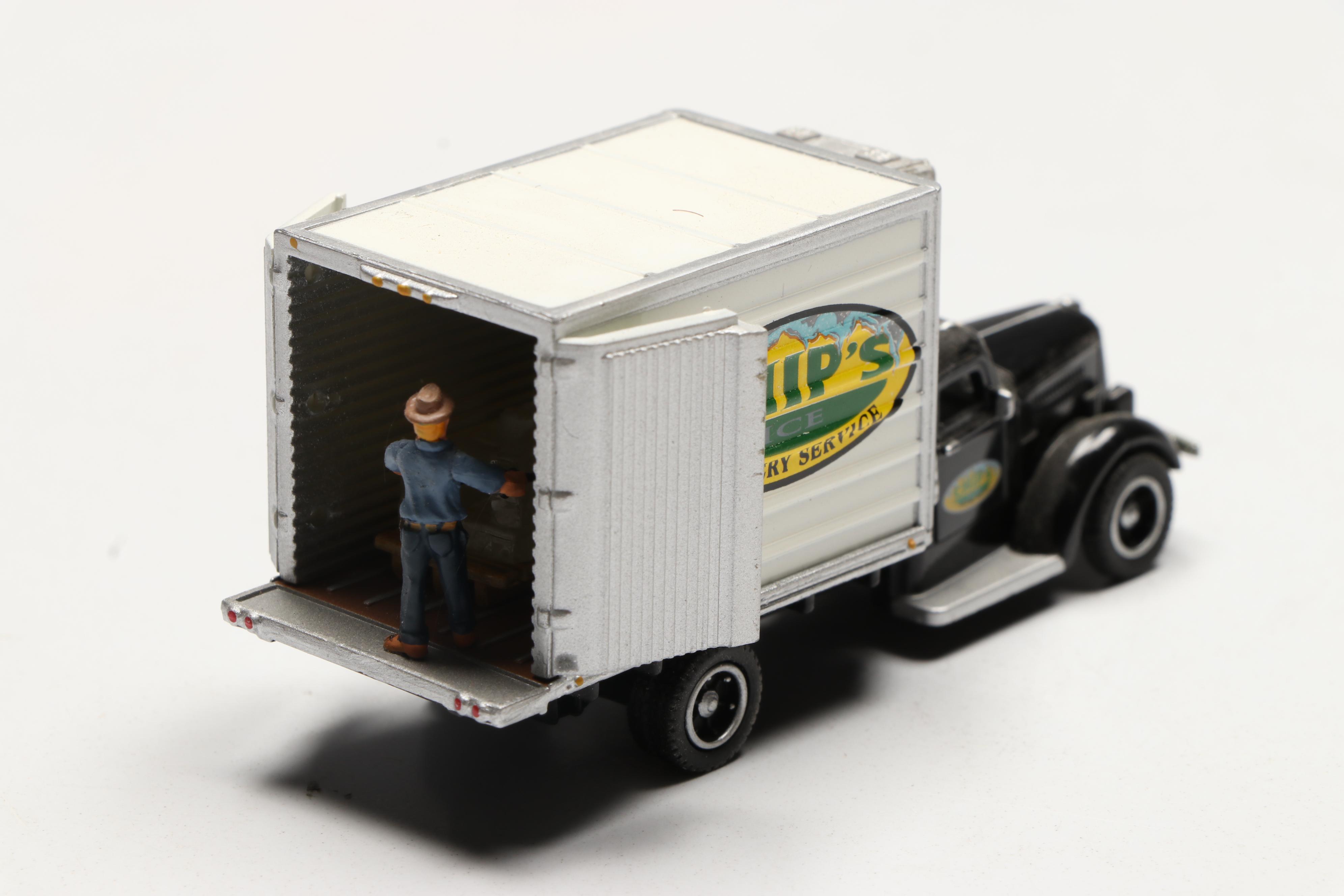 Golden, CMW with Other Train Prop Trucks and Bus