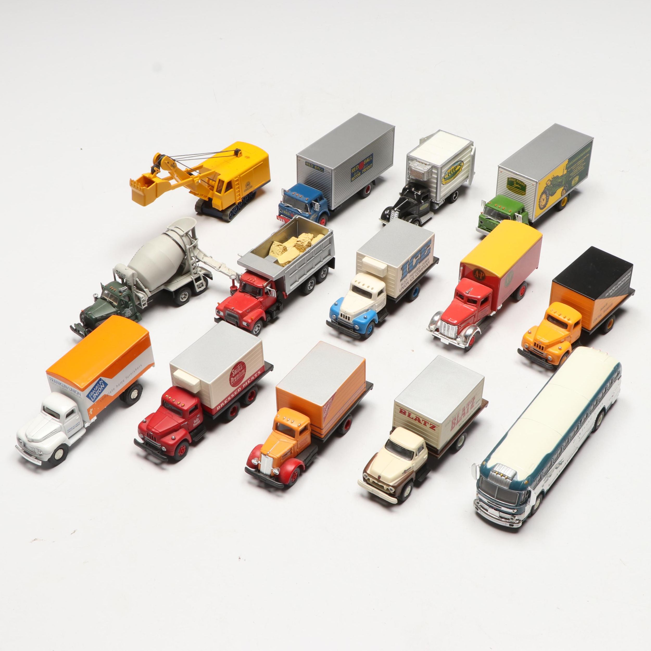 Golden, CMW with Other Train Prop Trucks and Bus