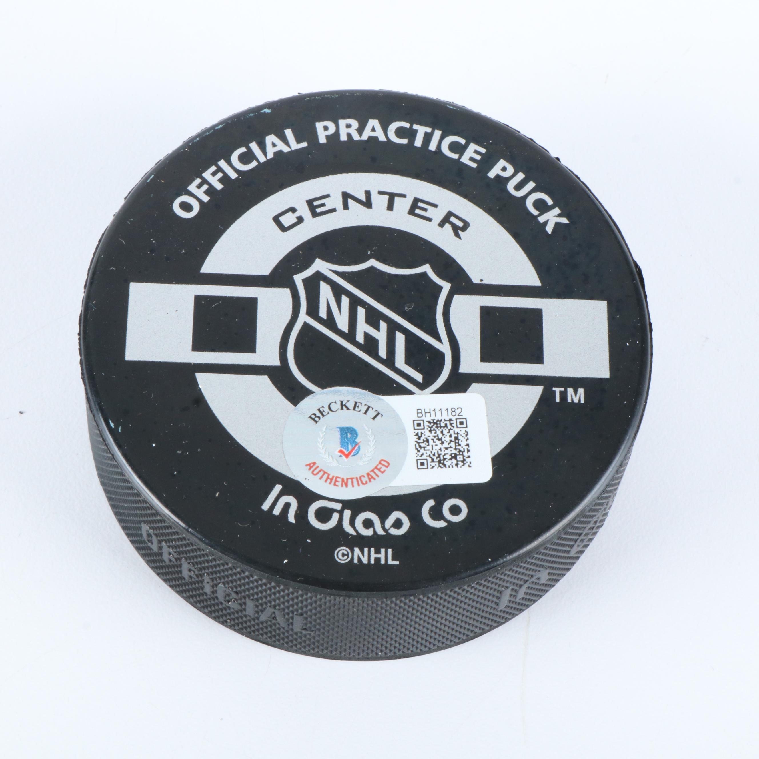 Bobby Hull and Steve Yzerman Signed NHL Hockey Pucks, Beckett