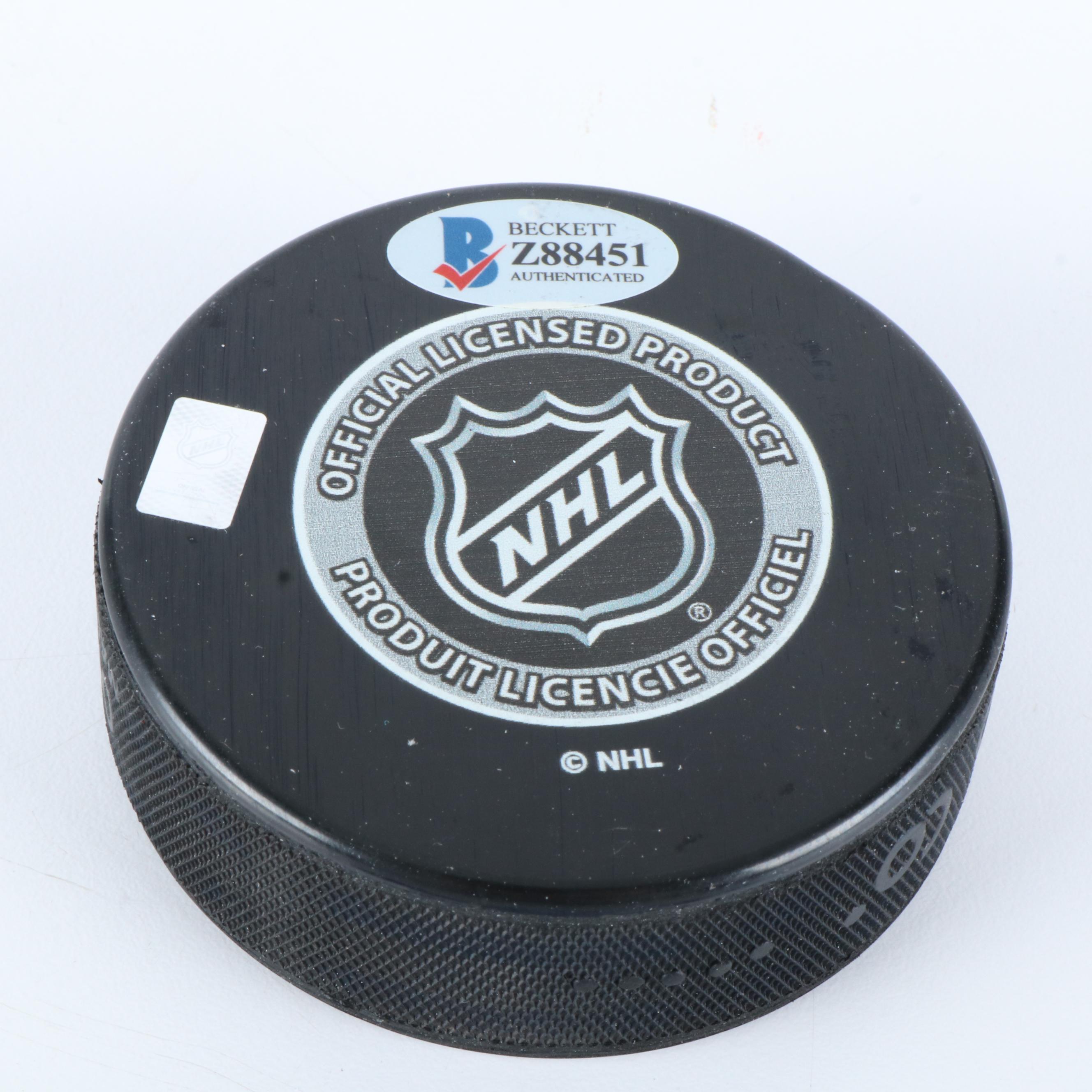 Bobby Hull and Steve Yzerman Signed NHL Hockey Pucks, Beckett