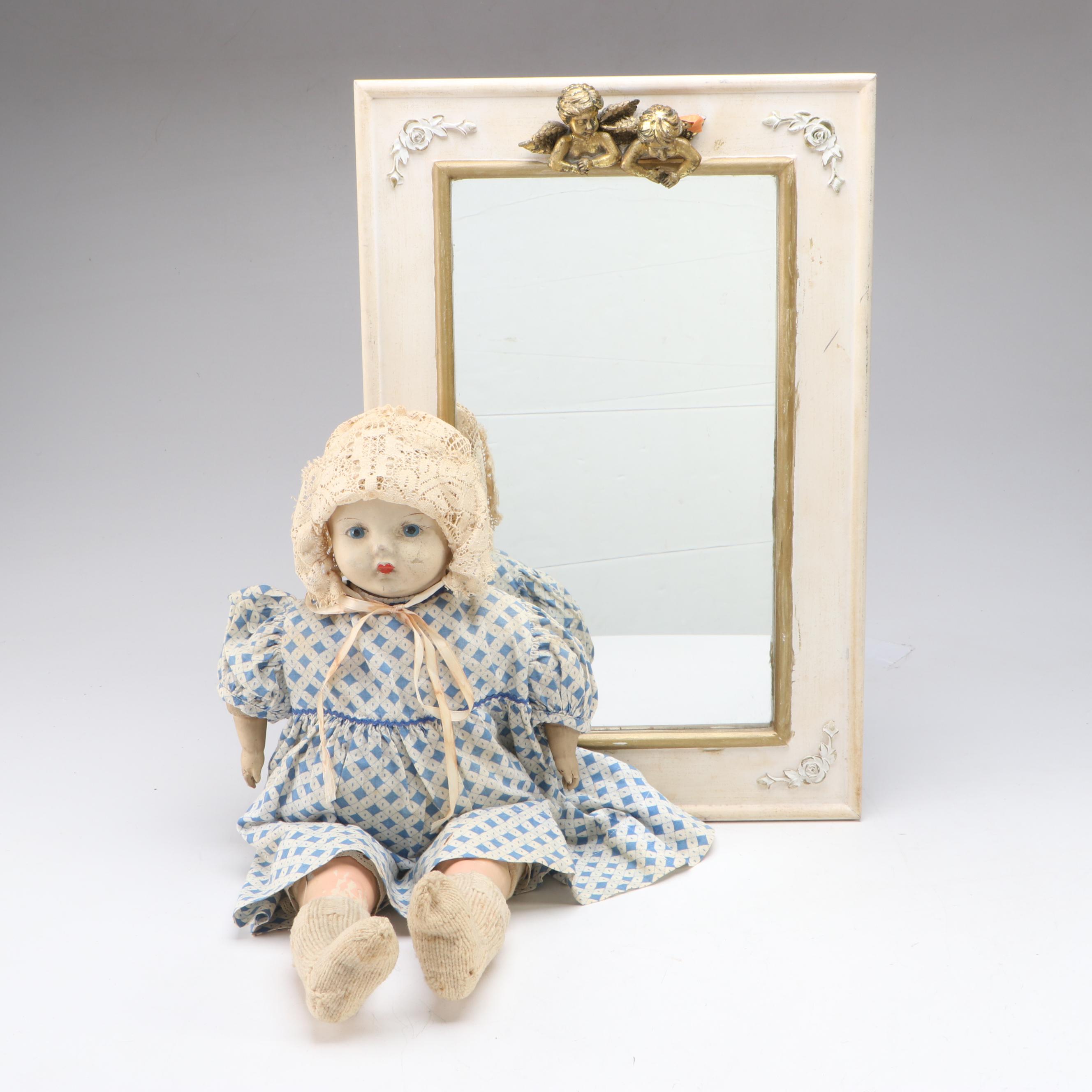 Papier-Mâché and Composition Doll with Cherub Accented Framed Wall Mirror