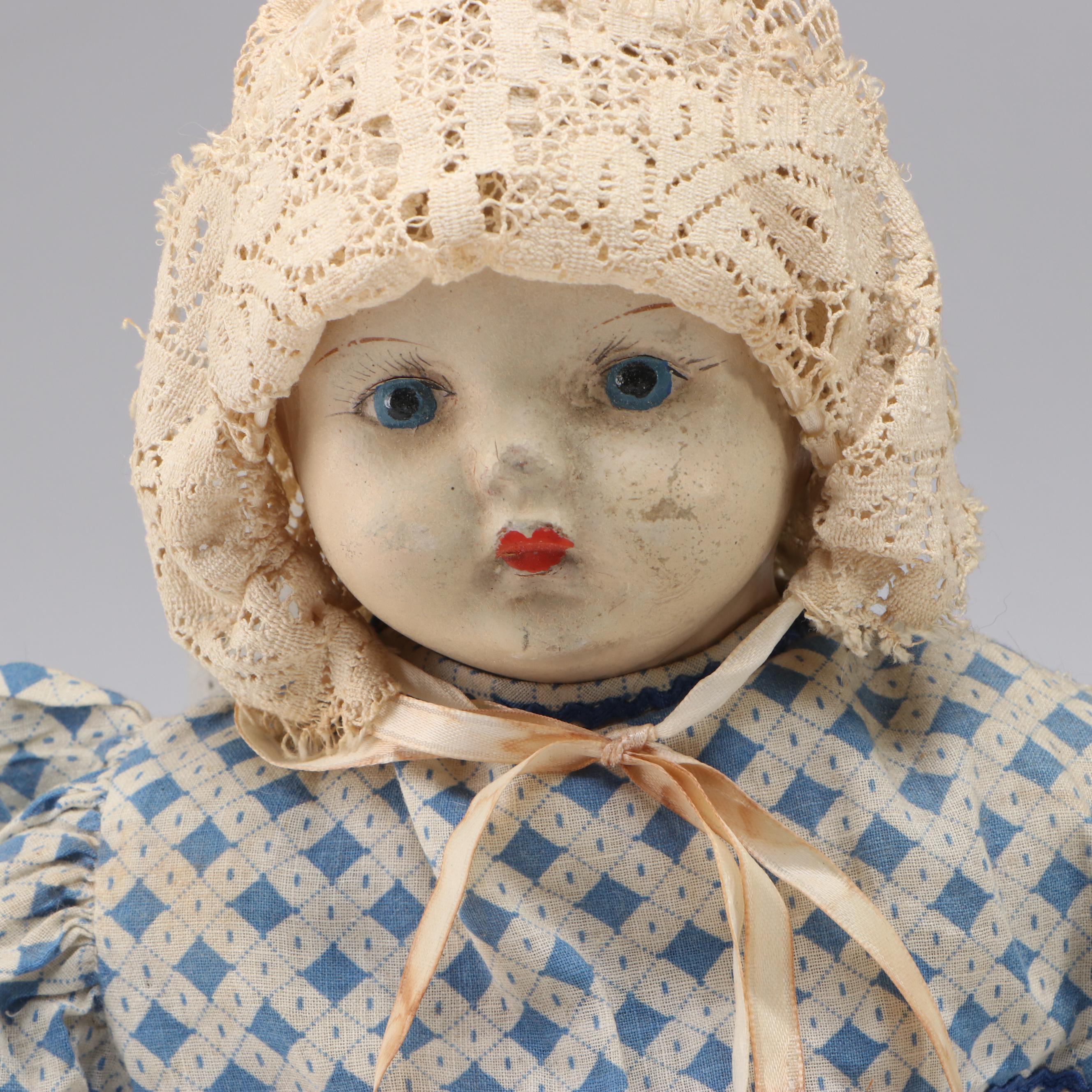 Papier-Mâché and Composition Doll with Cherub Accented Framed Wall Mirror