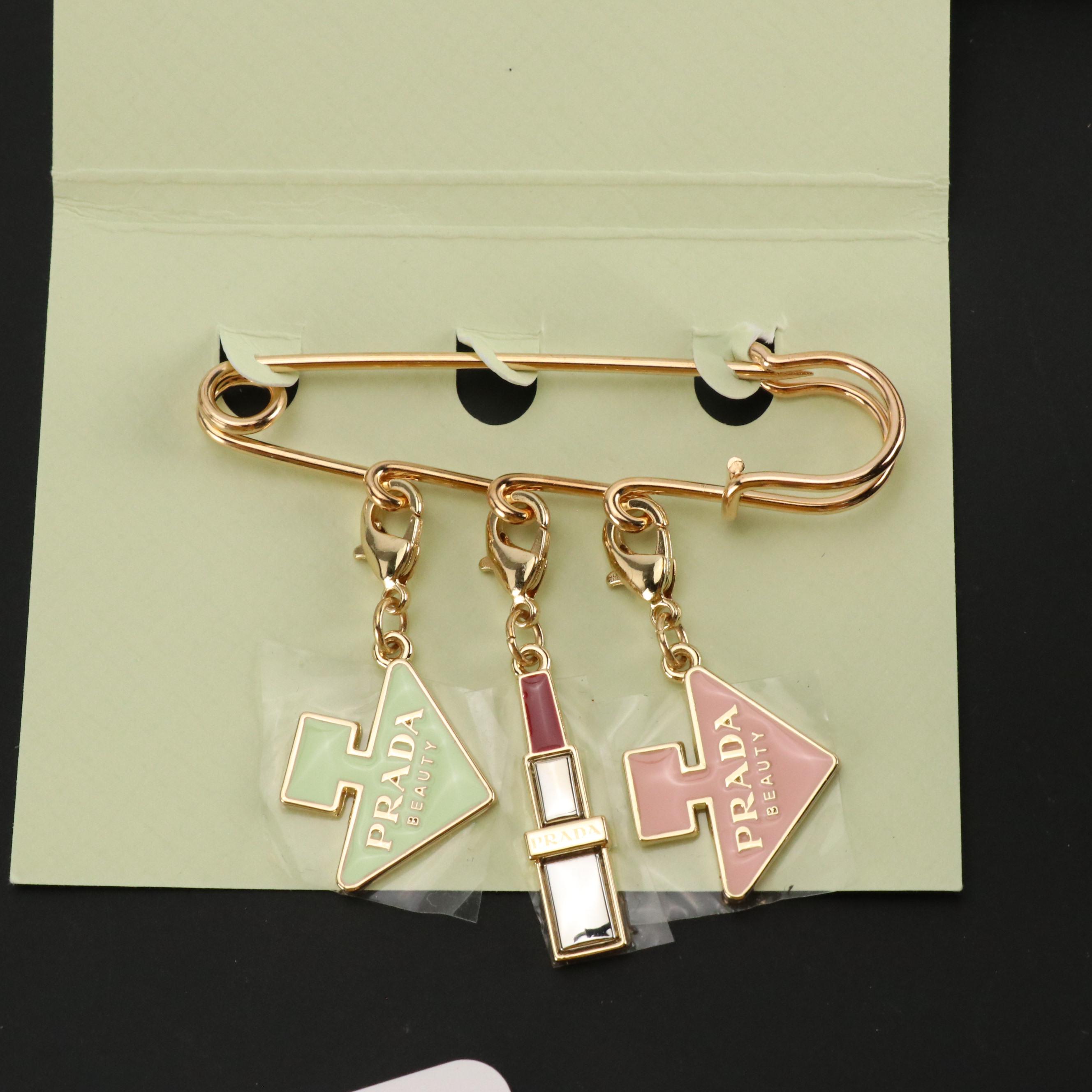 Prada Beauty Promotional Playing Cards, Charms Brooch Pin, and Stamp Set