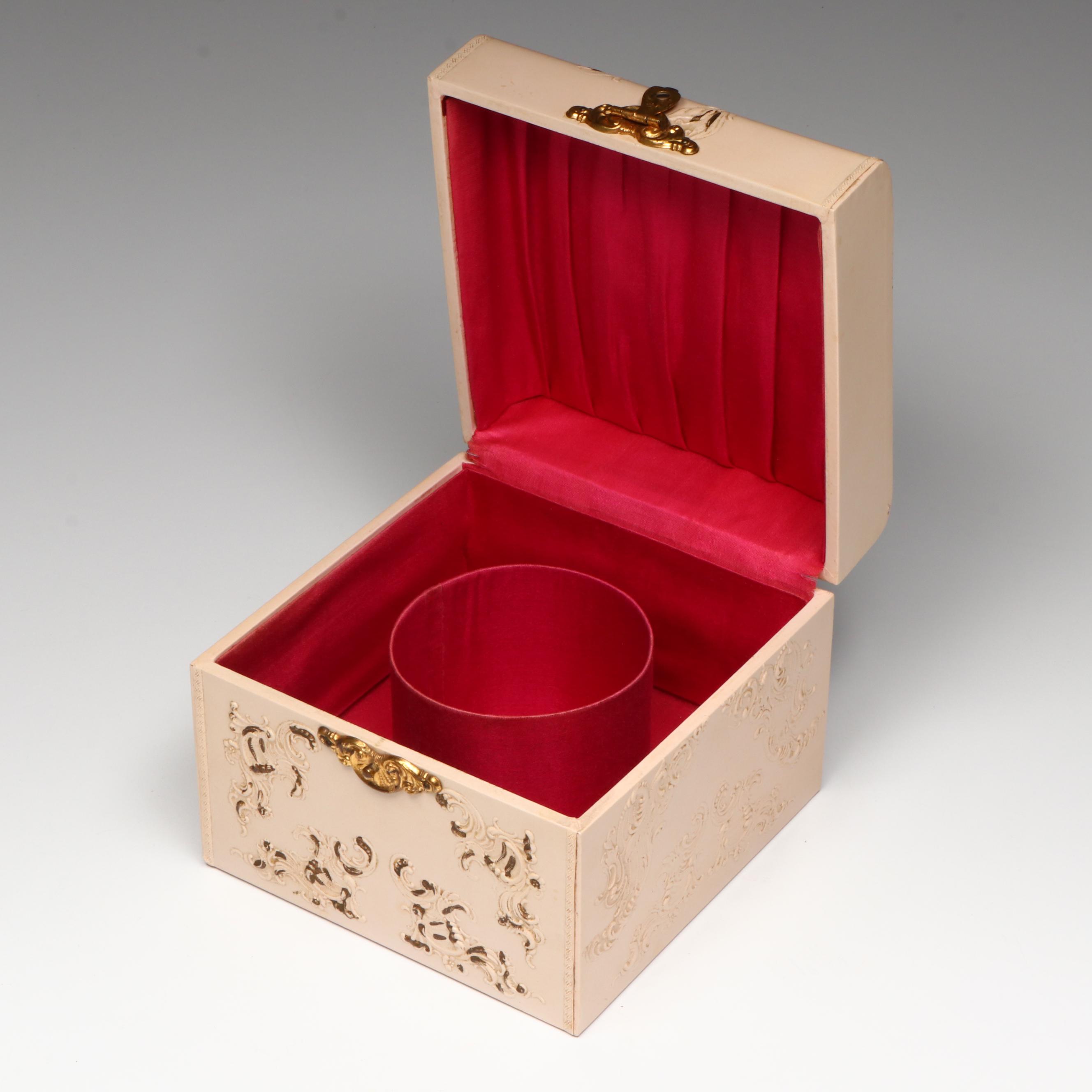 Embossed Pink Collar Box with an Assortment of Starched Collars