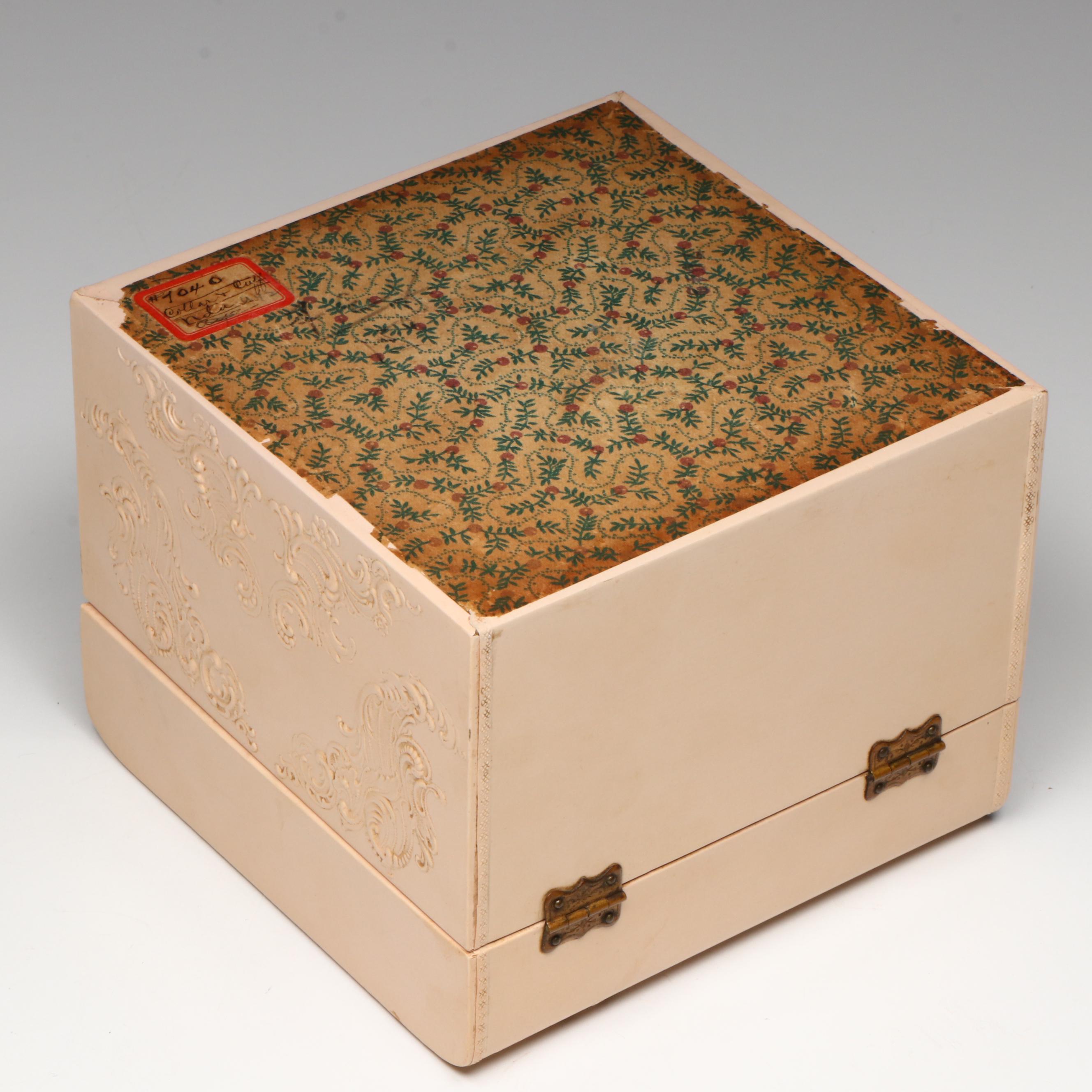 Embossed Pink Collar Box with an Assortment of Starched Collars