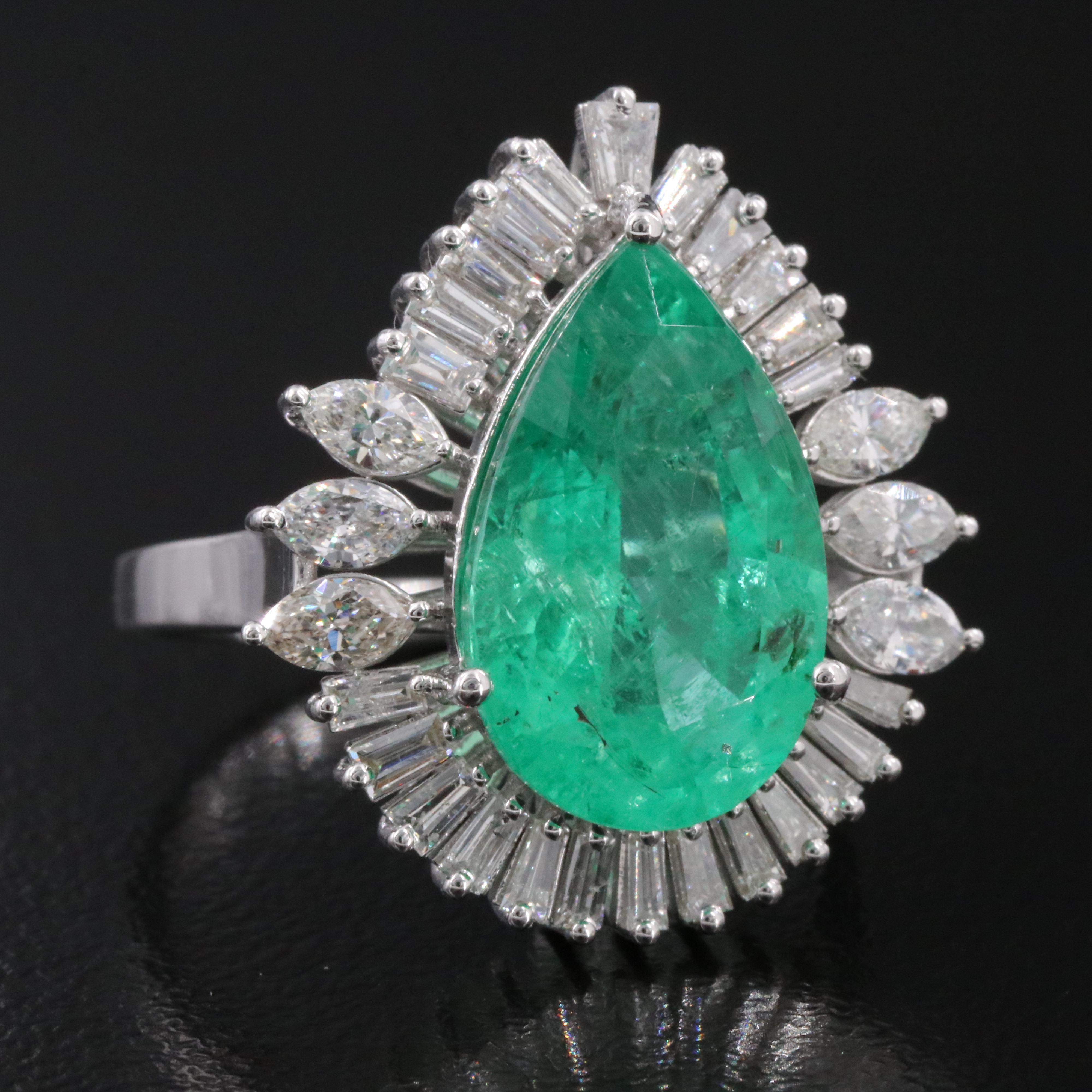 18K 5.17 CT Emerald and 1.05 CTW Diamond Ring
