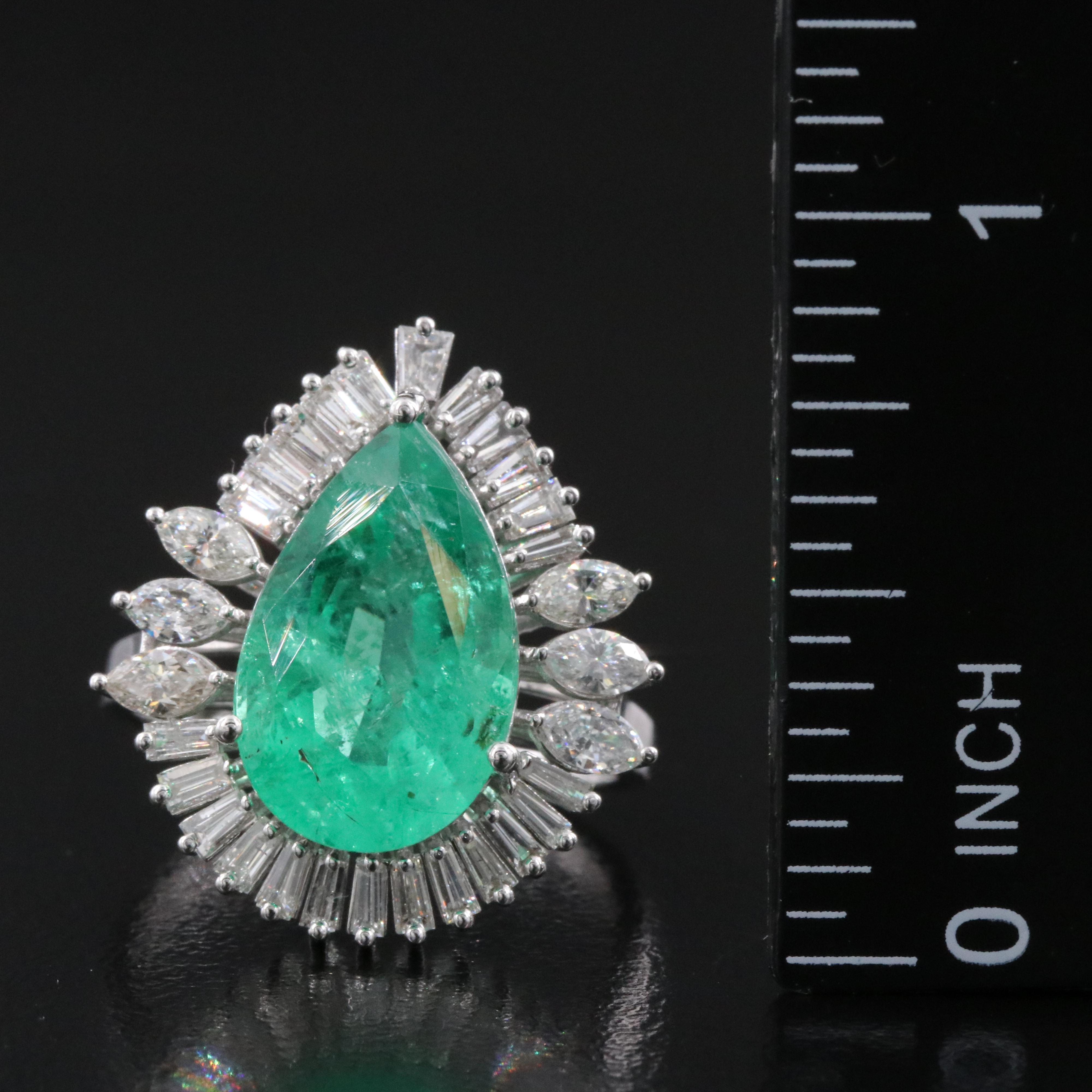 18K 5.17 CT Emerald and 1.05 CTW Diamond Ring