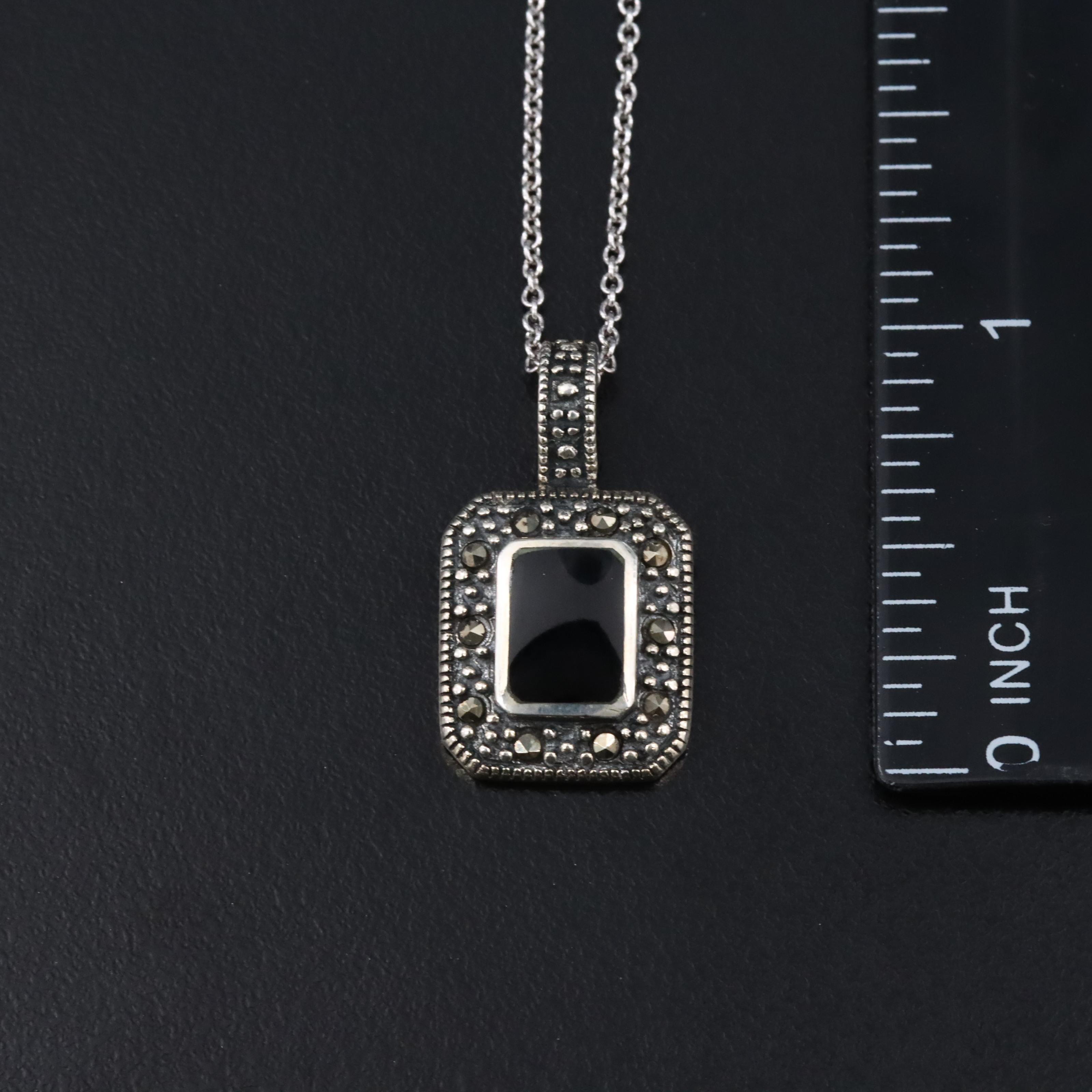 Assorted Sterling Jewelry with Amber, Black Onyx, and CZ