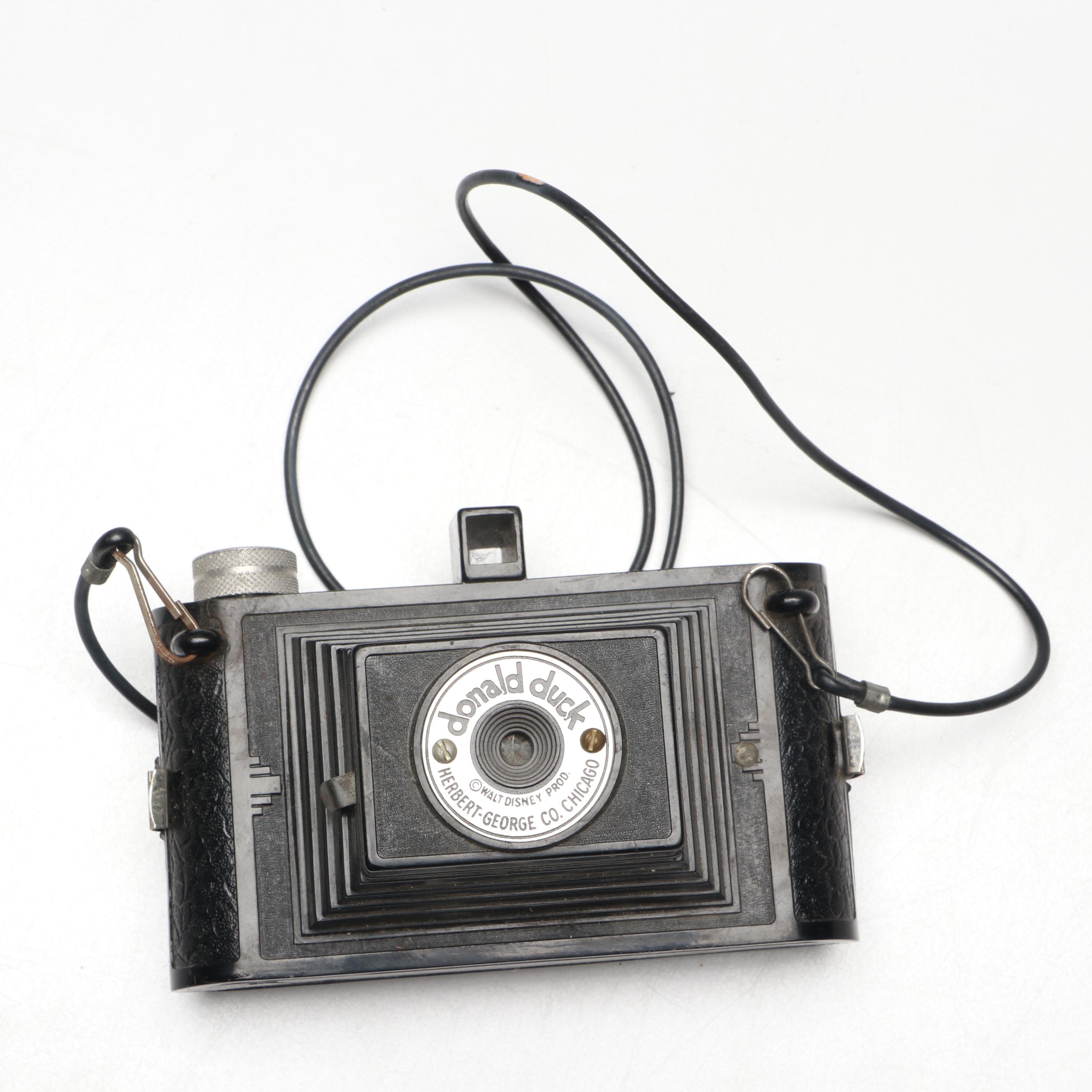 Eastman-Kodak Folding Camera with Herbert-George Co. "Donald Duck" Box Cameras