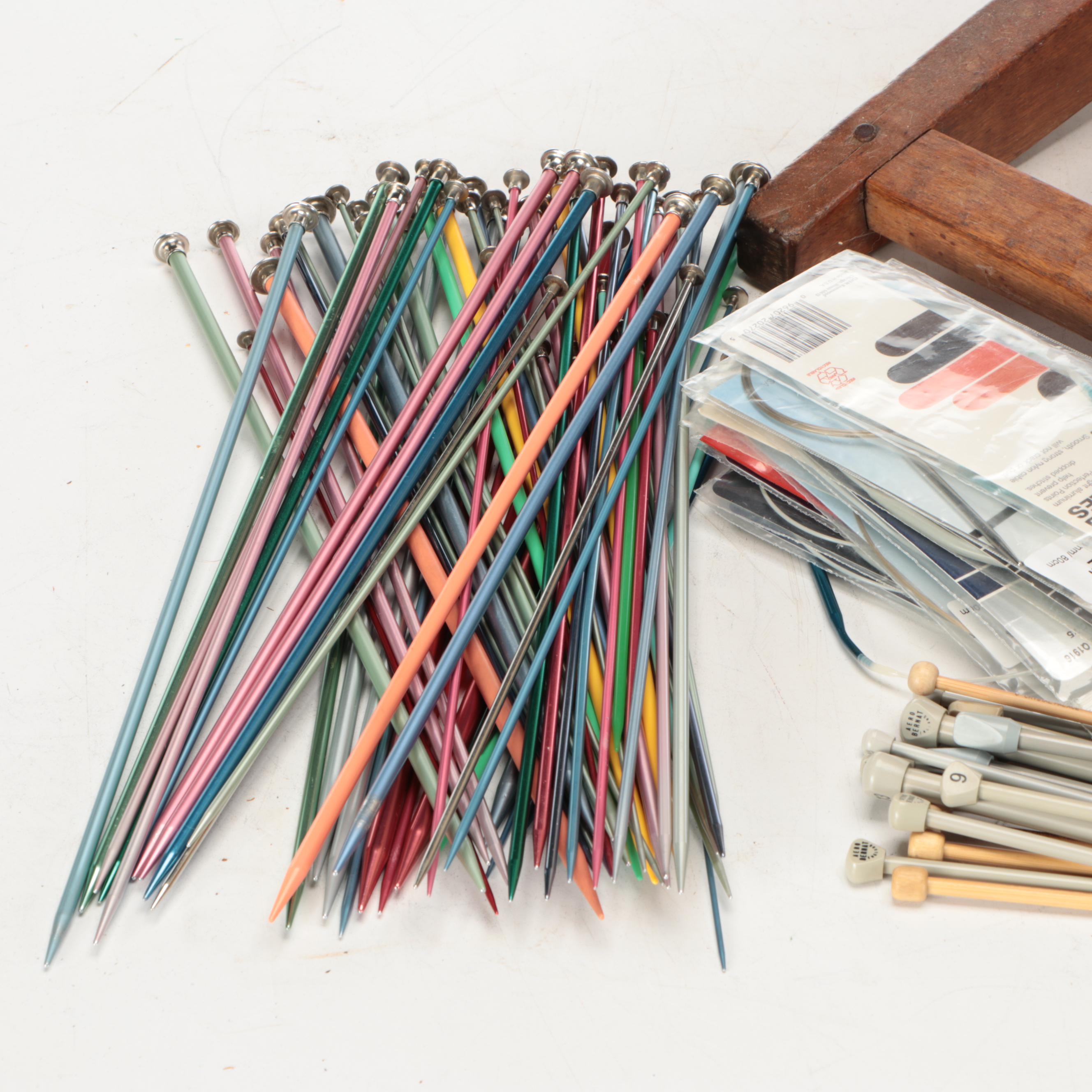Primitive Style Wooden Spinning Wheel with Baskets and Knitting Supplies
