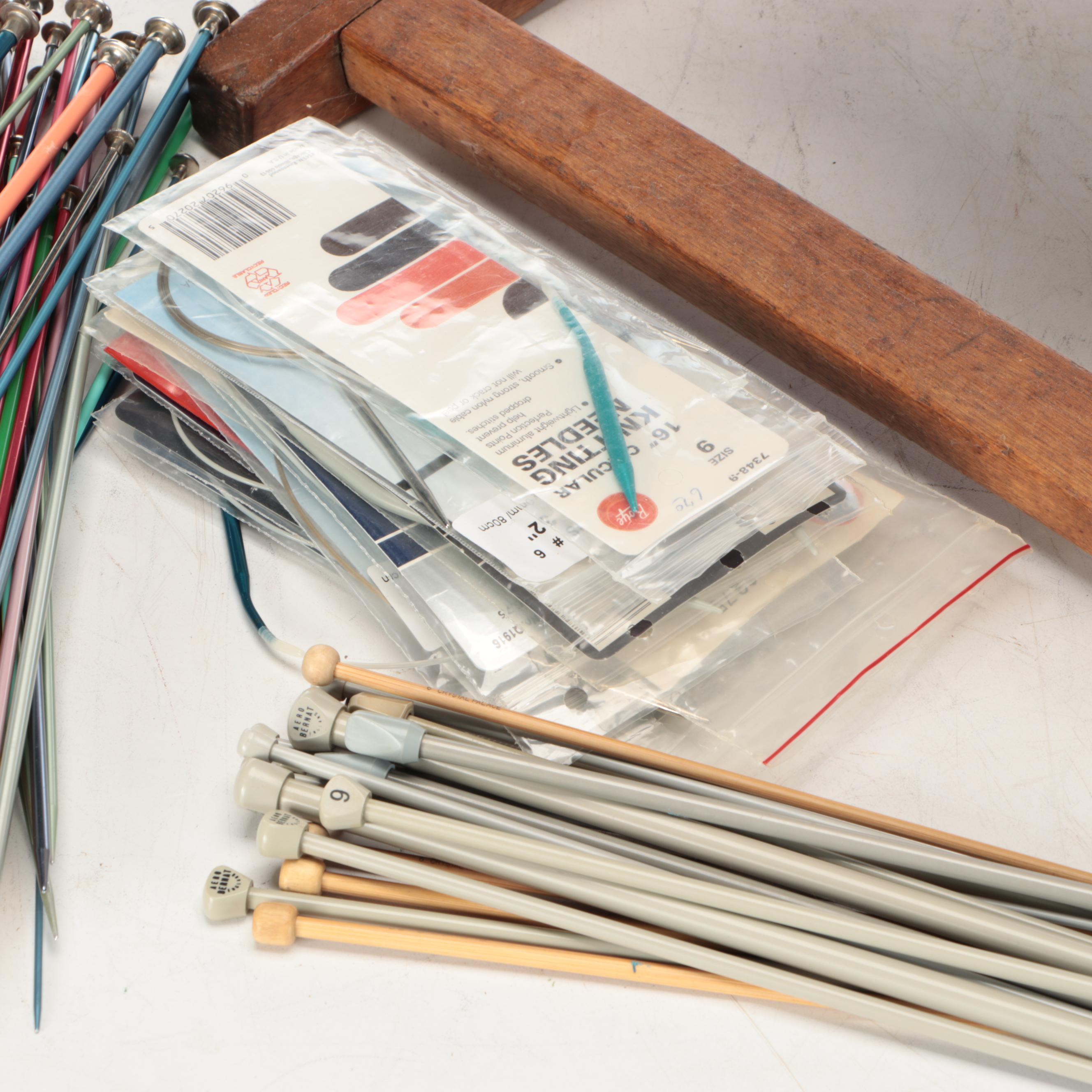 Primitive Style Wooden Spinning Wheel with Baskets and Knitting Supplies