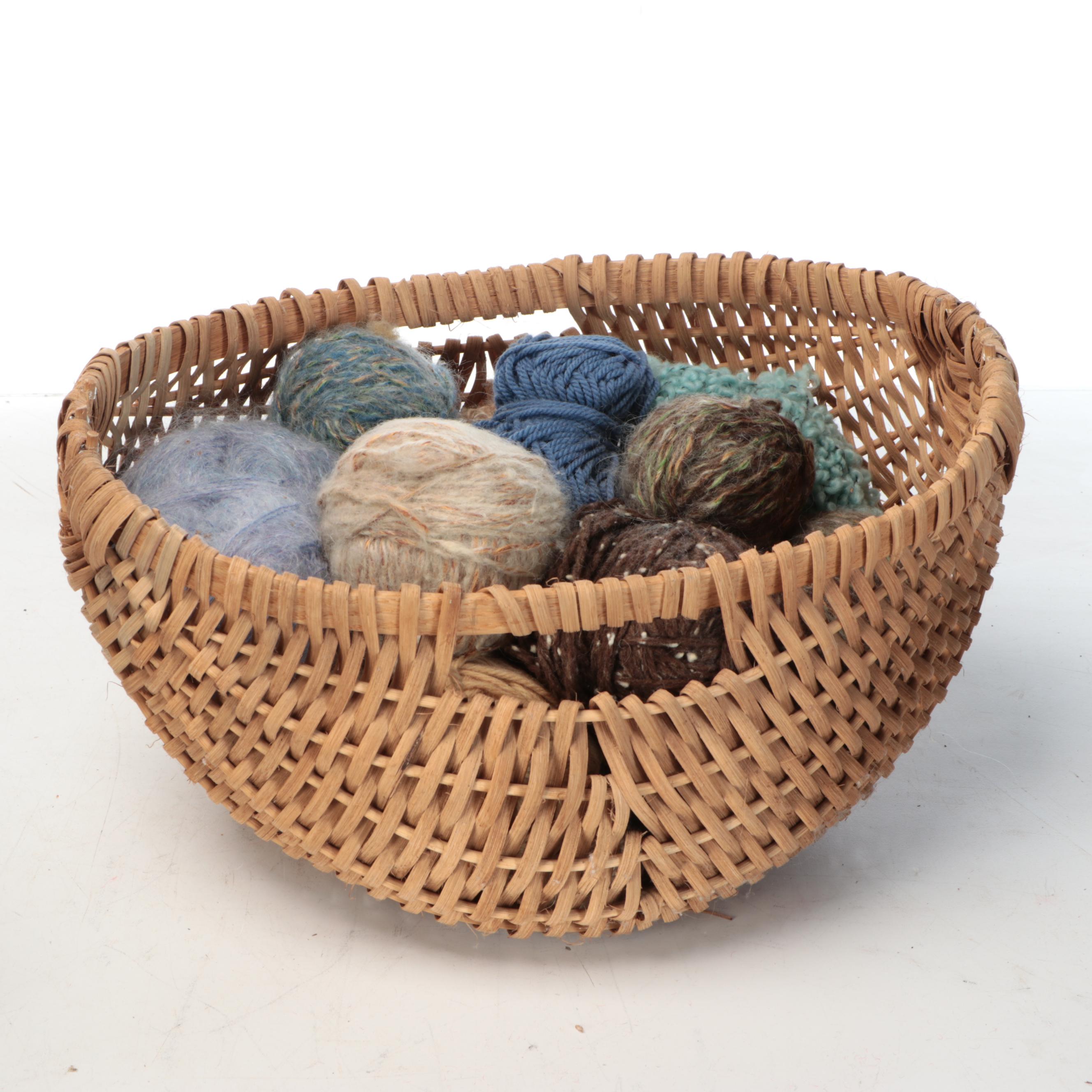 Primitive Style Wooden Spinning Wheel with Baskets and Knitting Supplies