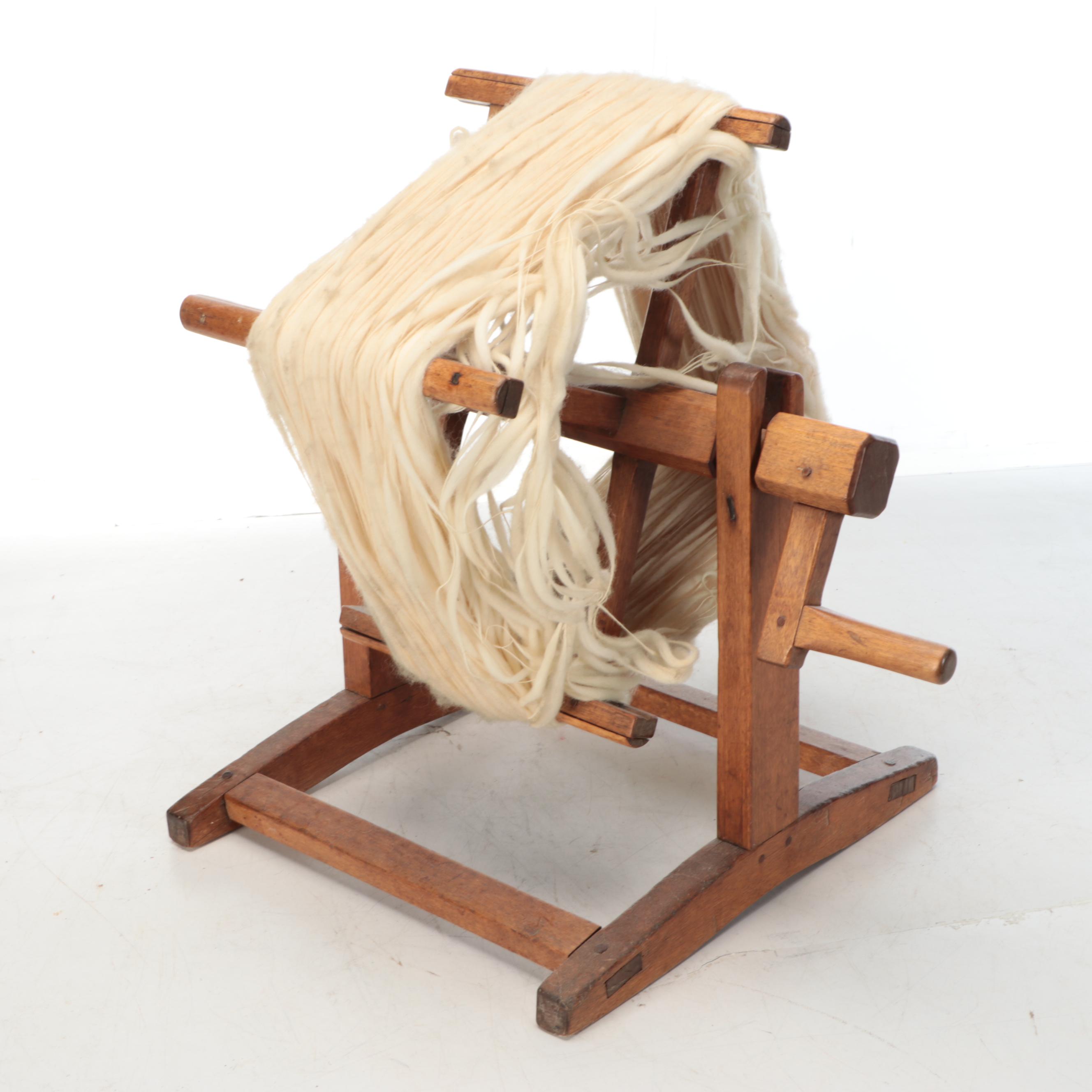 Primitive Style Wooden Spinning Wheel with Baskets and Knitting Supplies