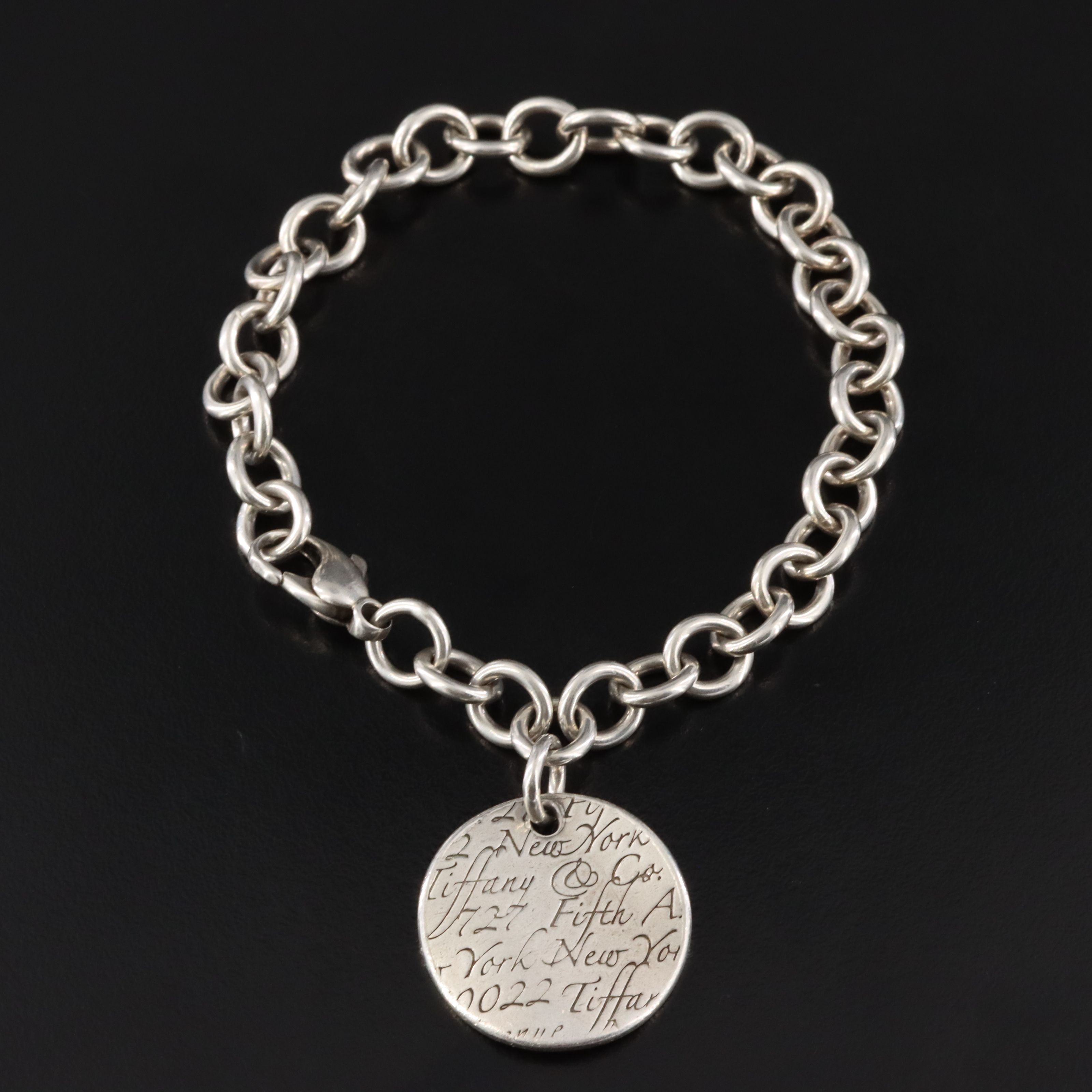 Tiffany & Co. Notes Sterling Round Tag Charm Bracelet