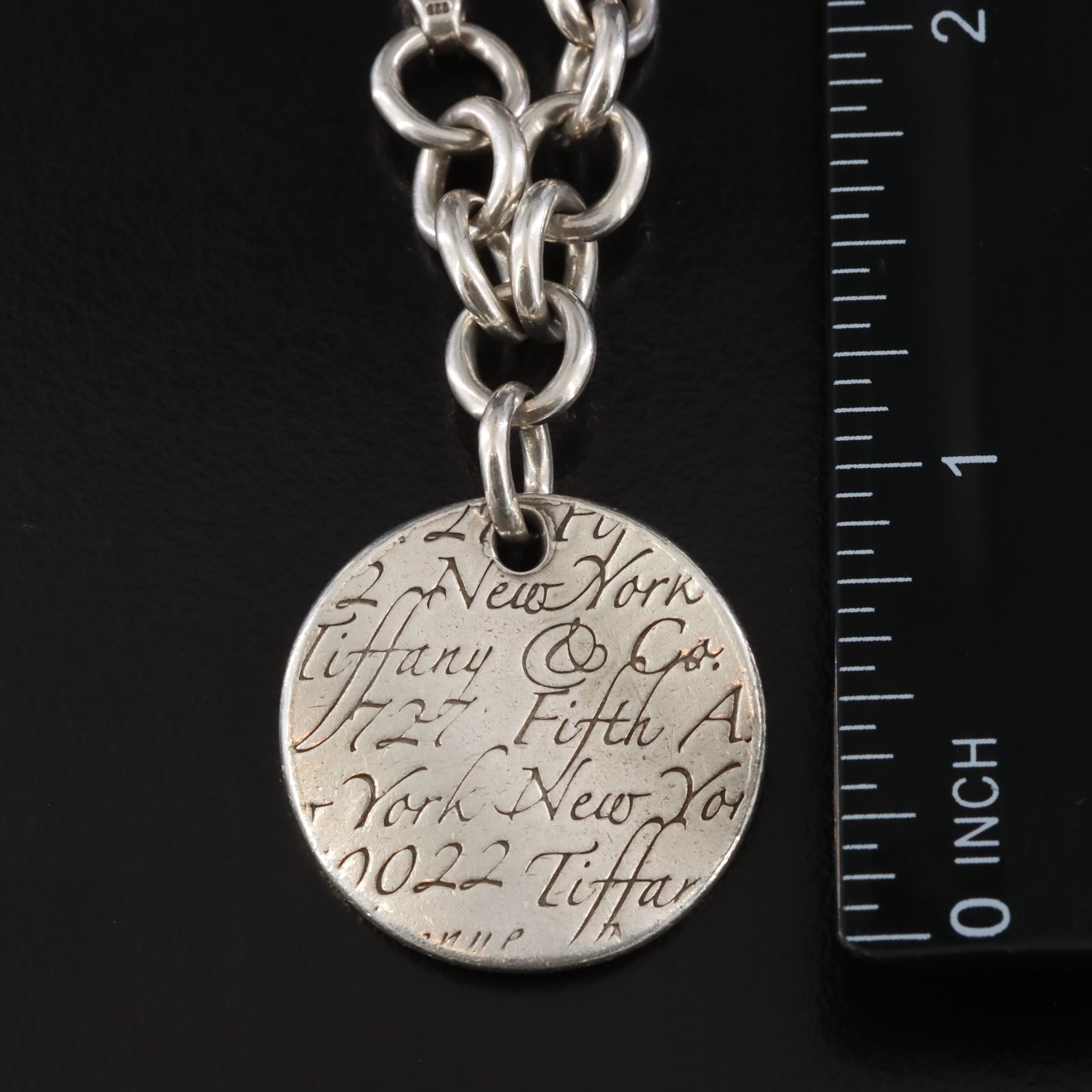 Tiffany & Co. Notes Sterling Round Tag Charm Bracelet