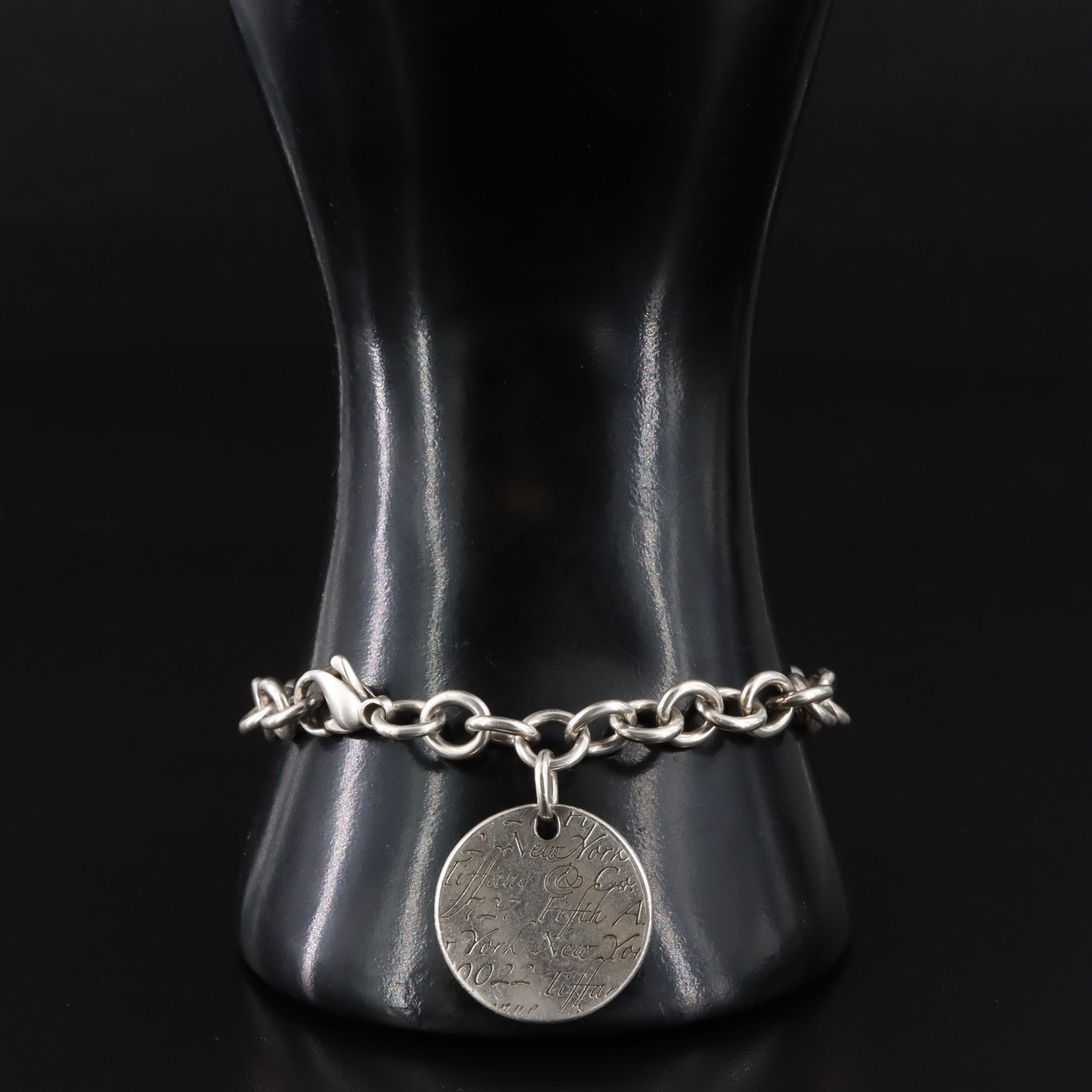 Tiffany & Co. Notes Sterling Round Tag Charm Bracelet