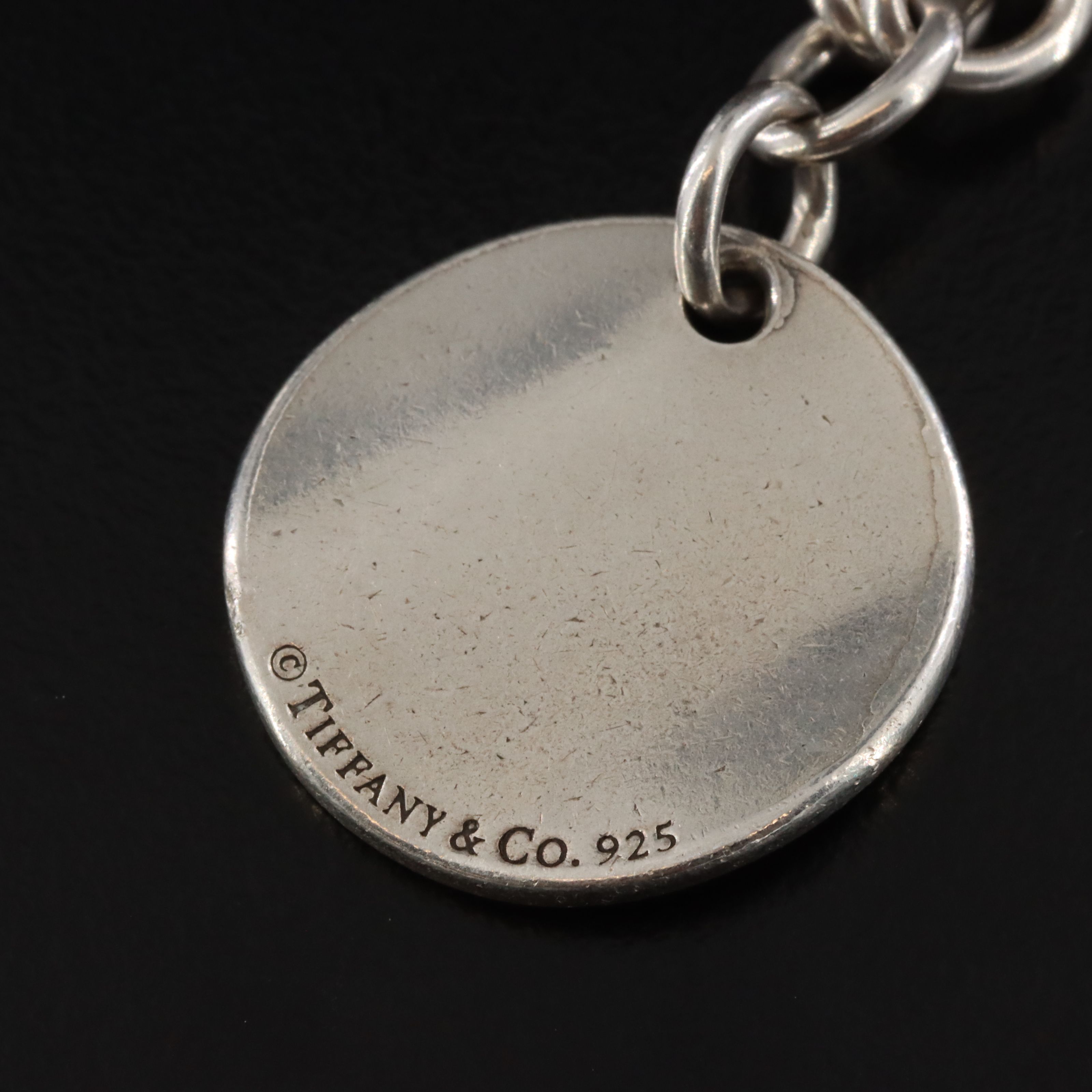 Tiffany & Co. Notes Sterling Round Tag Charm Bracelet