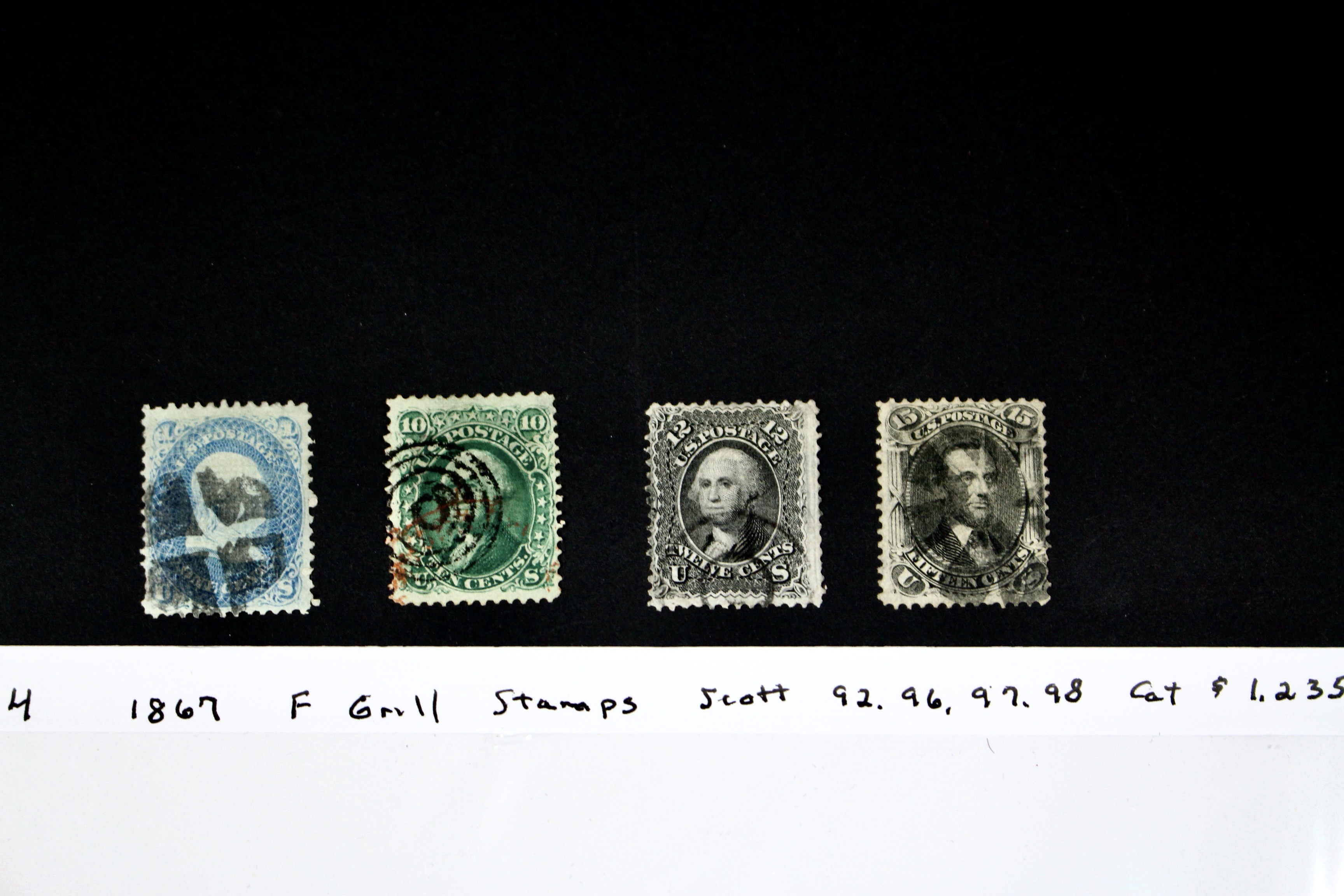Four 1867 U.S. Postage Stamps with F Grill