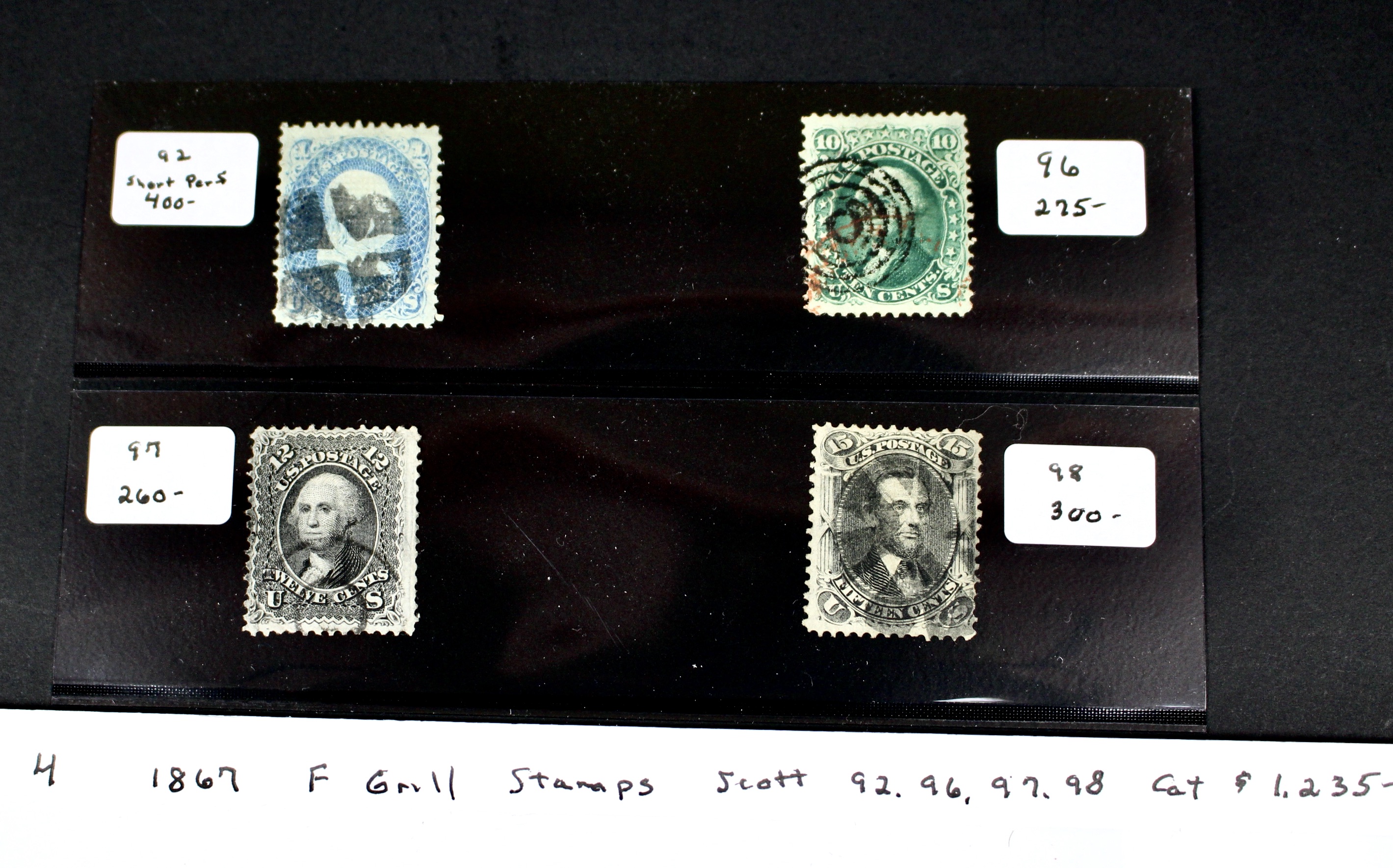 Four 1867 U.S. Postage Stamps with F Grill