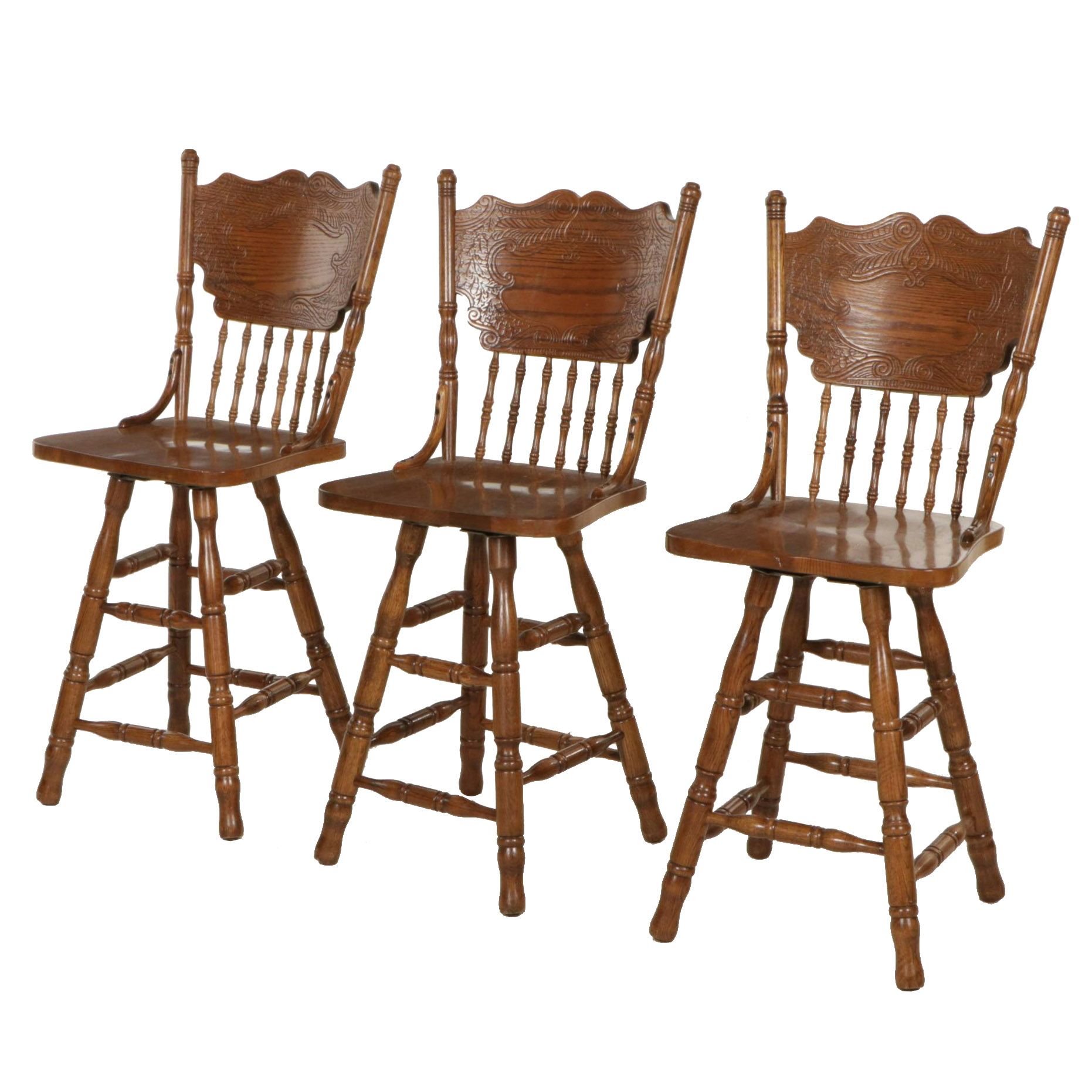 Three Victorian Style Oak Press-Back Swivel Barstools