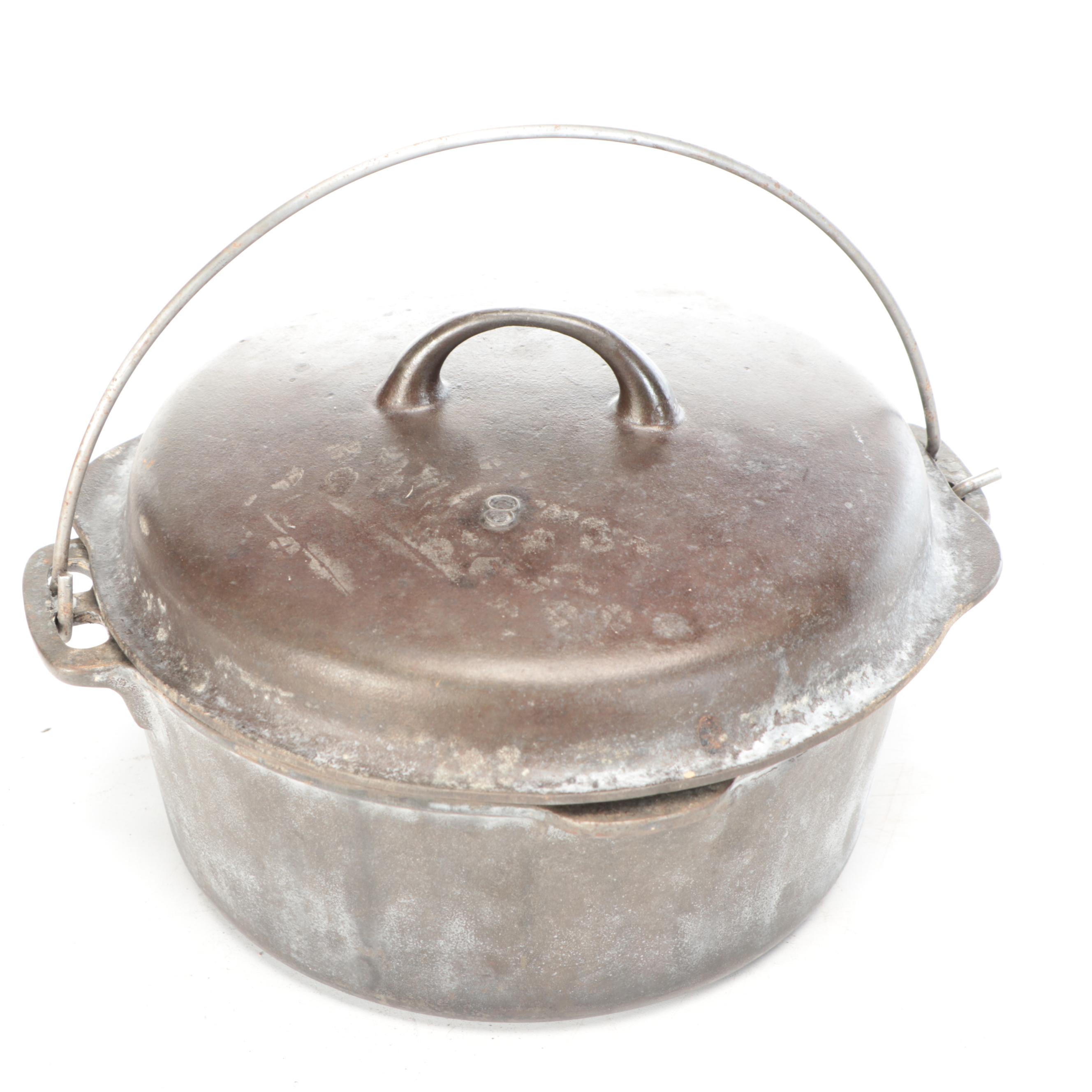 Wagner and Other Cast Iron Dutch Ovens with Metal Bail Handles, 20th Century