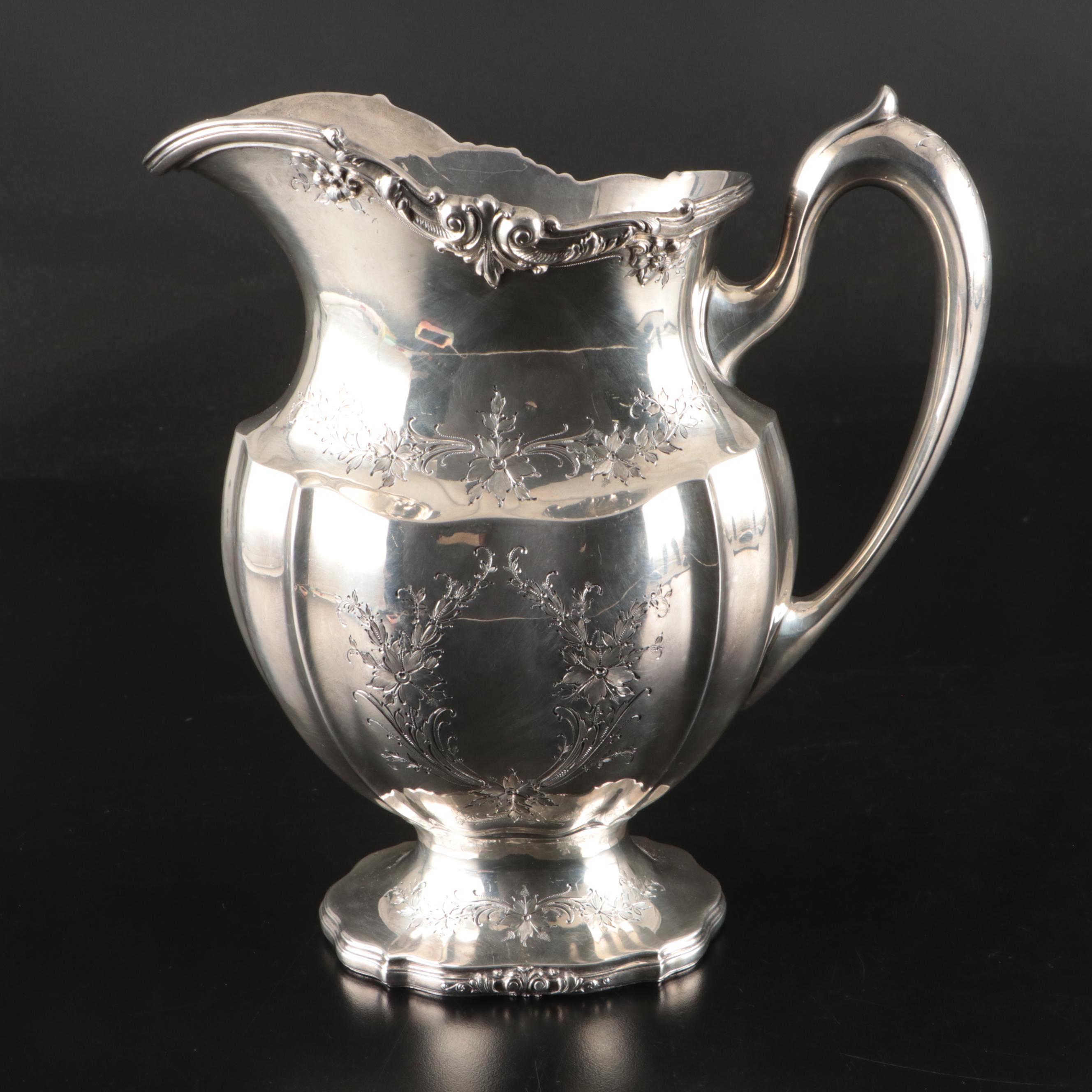 Redlich & Company Chased Floral Sterling Silver Pitcher, Early 20th Century
