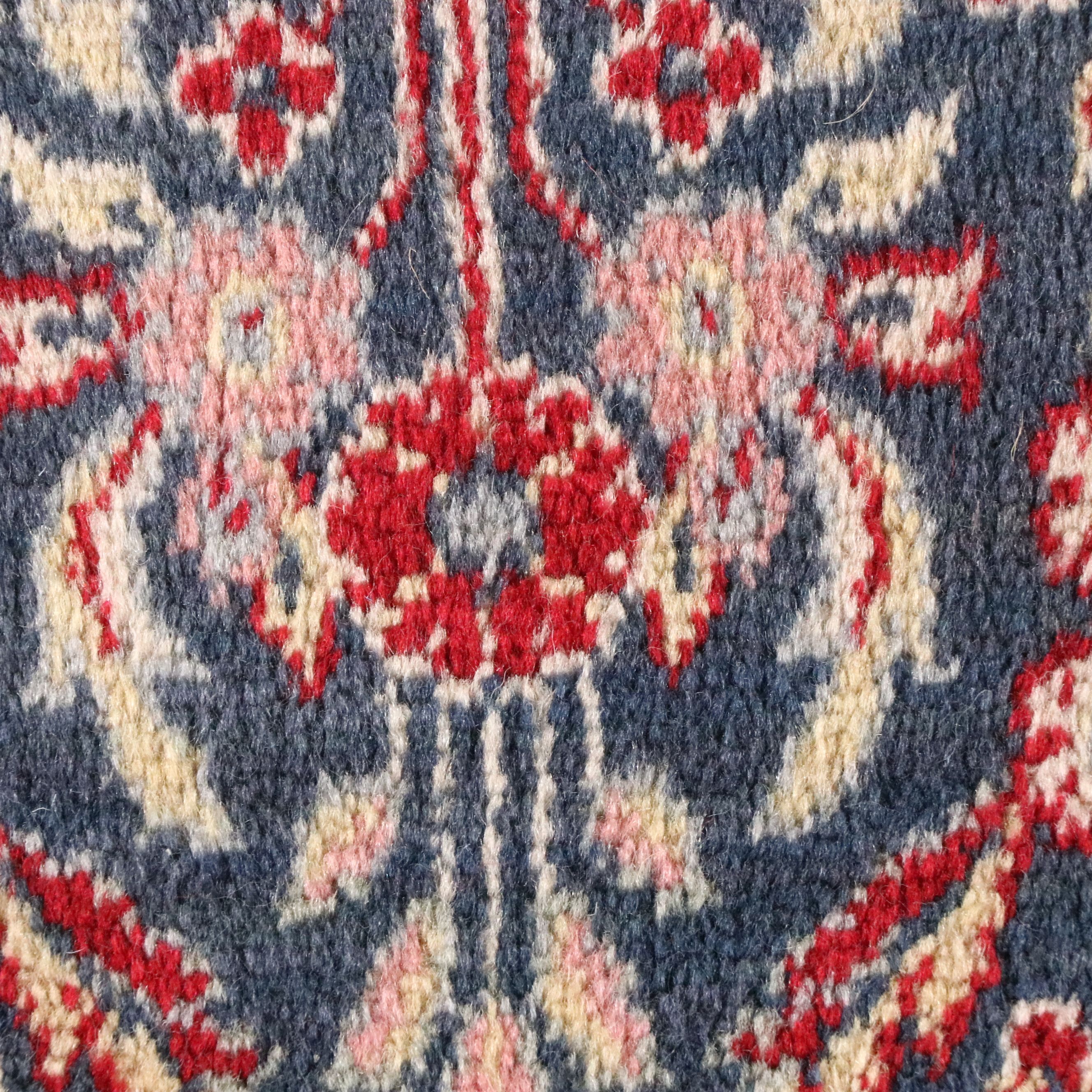 Four Machine-Made Persian Style Accent Rugs
