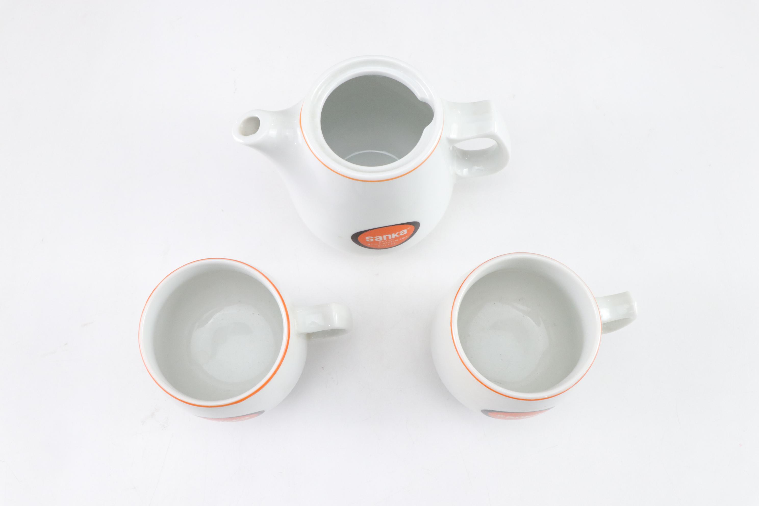 Orange Calcite Carved Owl with Sanka Decaf Coffee Pot