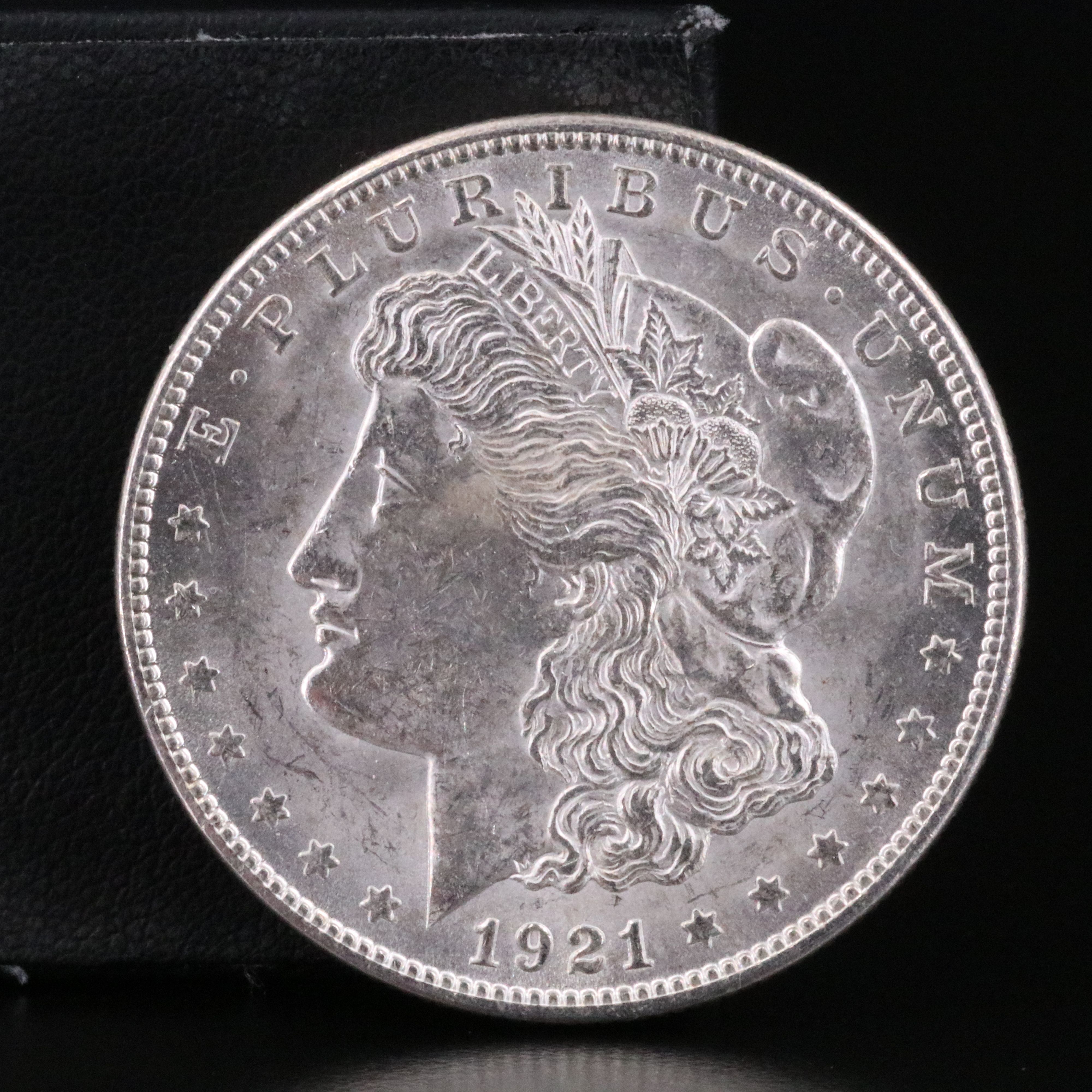 Three Uncirculated  U.S. Morgan and Peace Silver Dollars