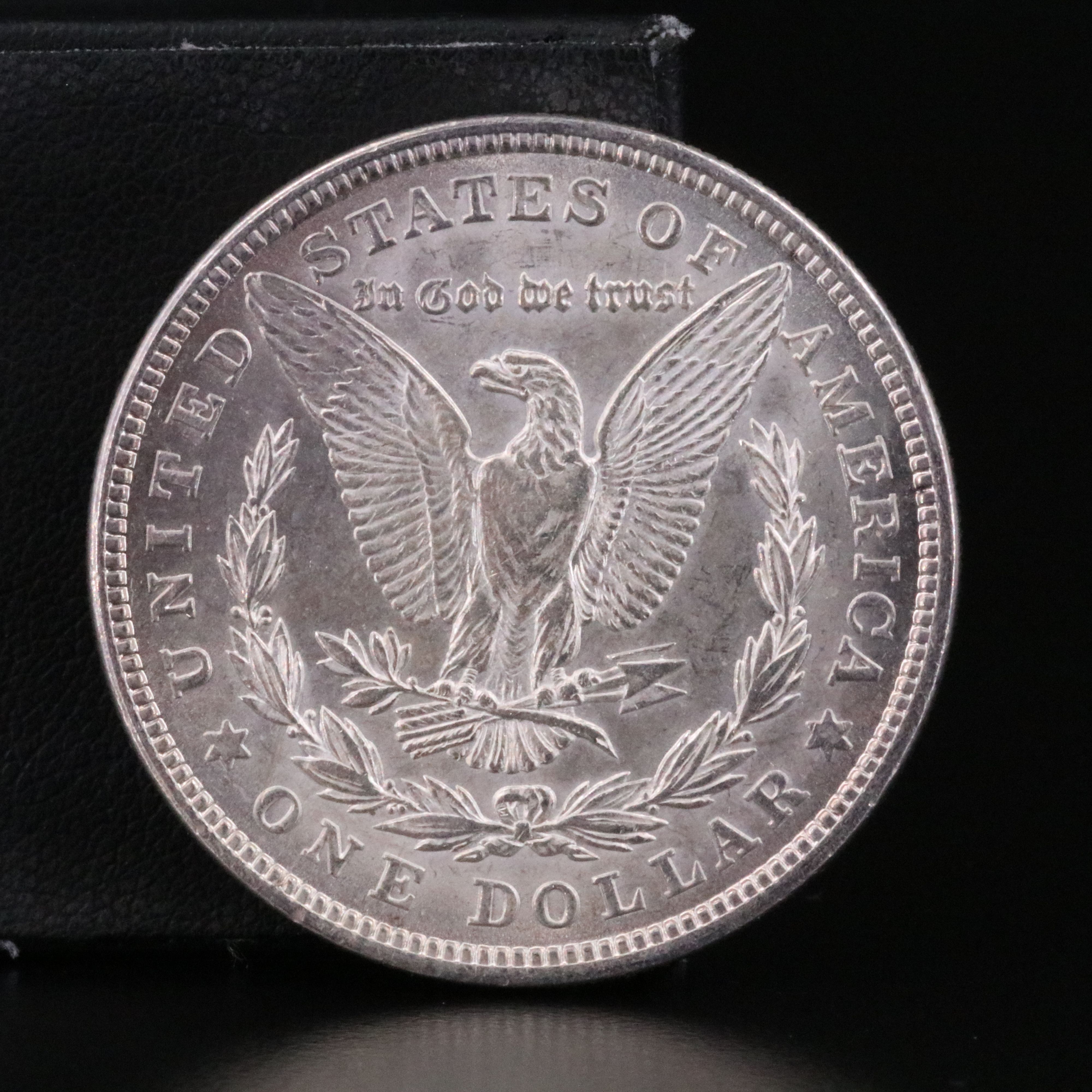 Three Uncirculated  U.S. Morgan and Peace Silver Dollars