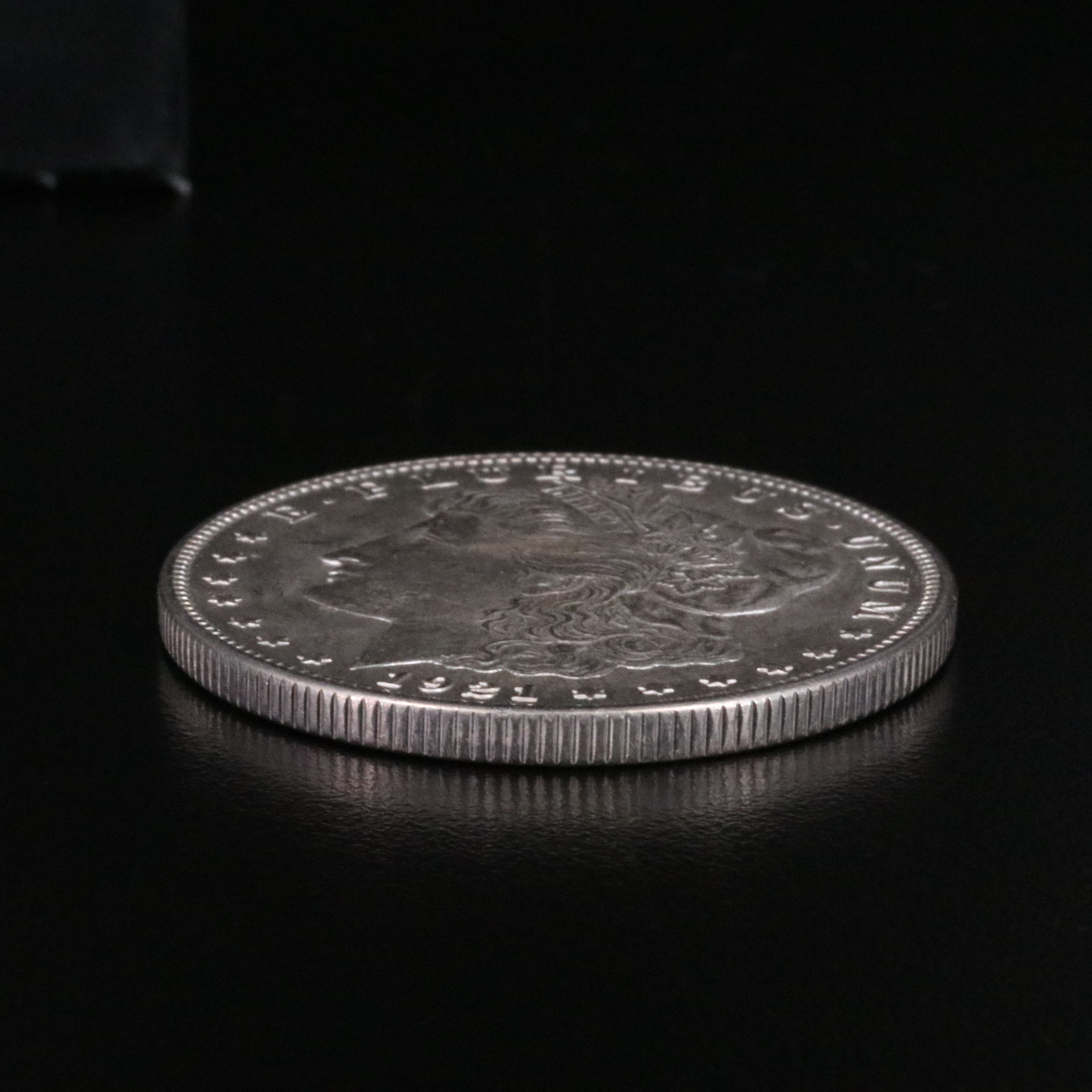 Three Uncirculated  U.S. Morgan and Peace Silver Dollars