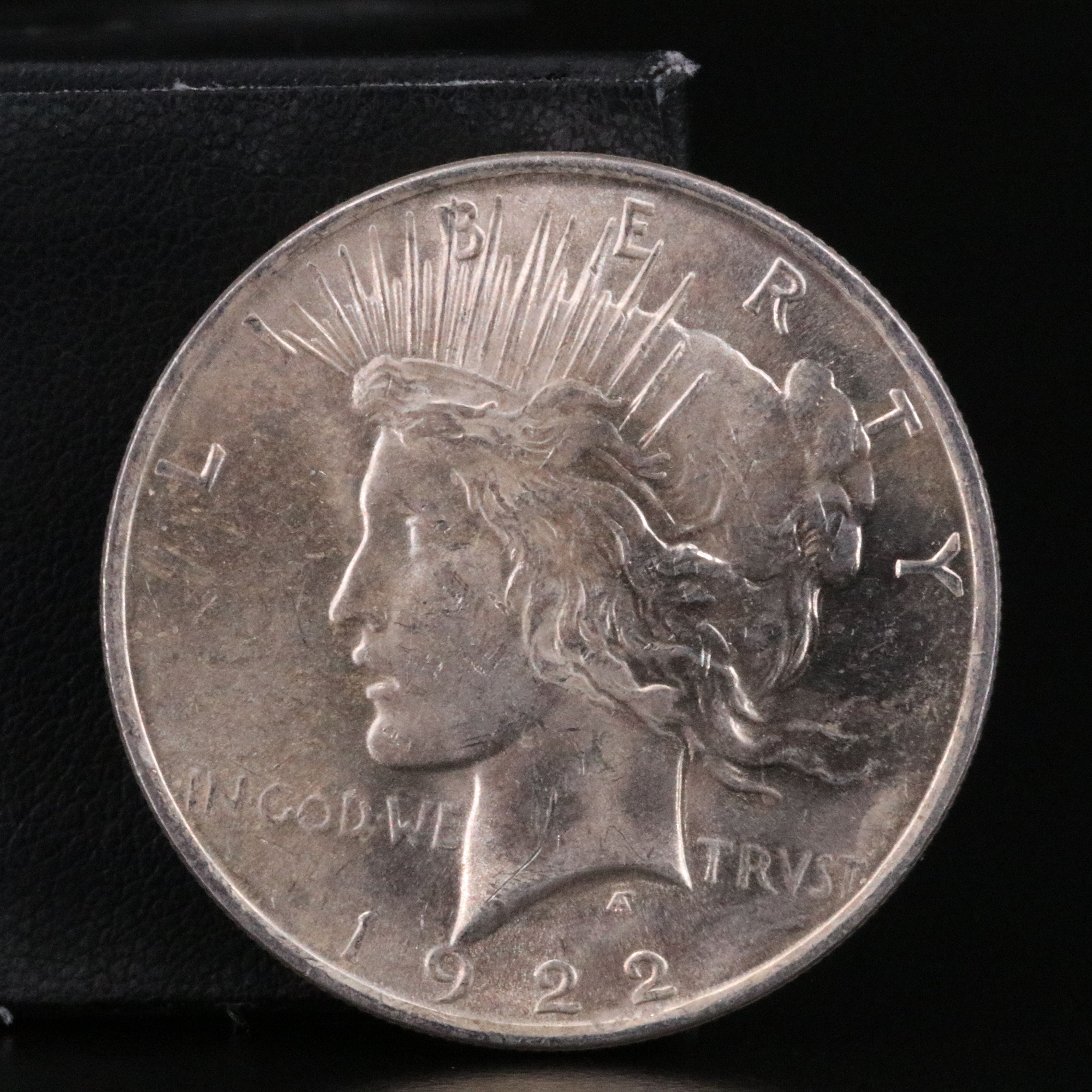 Three Uncirculated  U.S. Morgan and Peace Silver Dollars