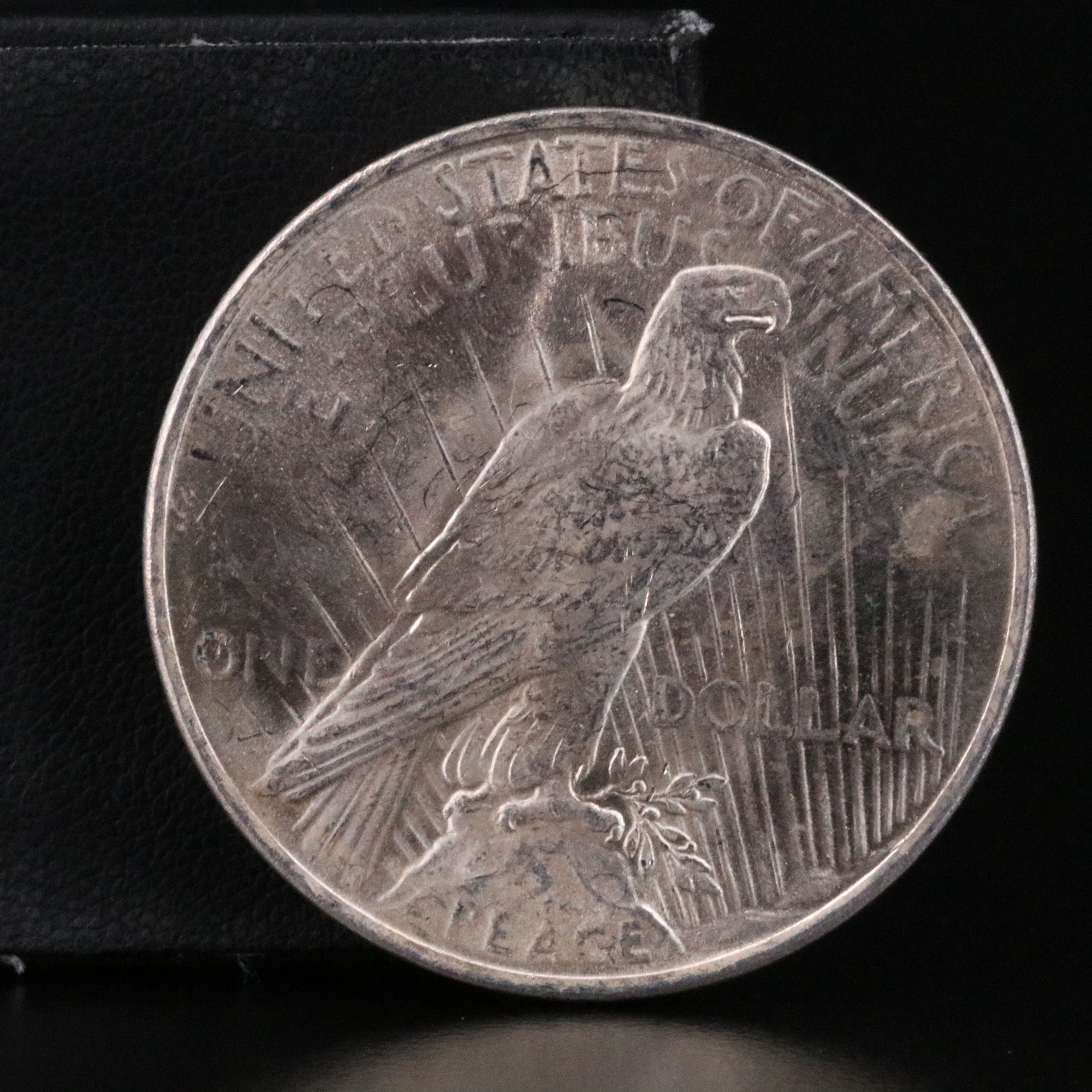 Three Uncirculated  U.S. Morgan and Peace Silver Dollars