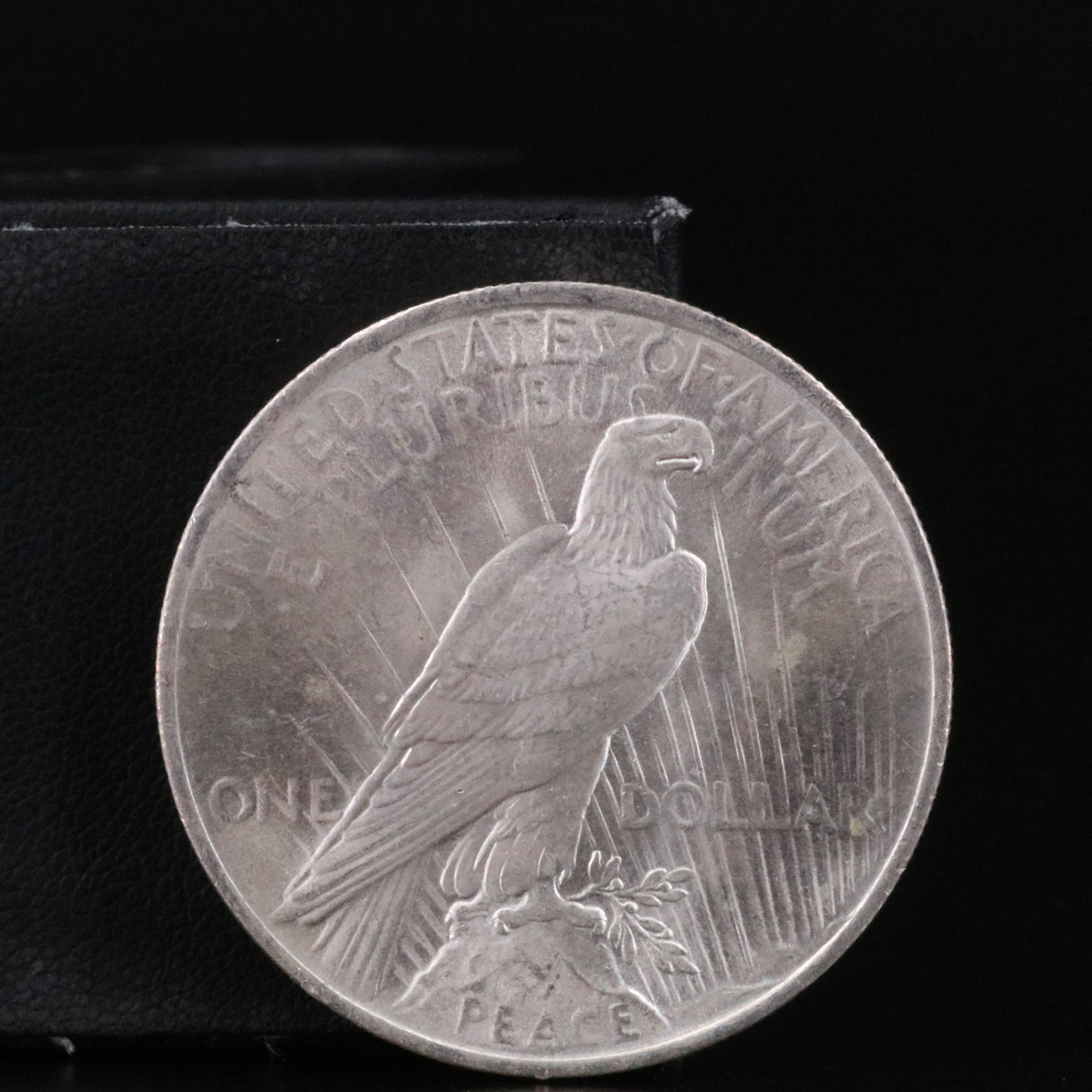 Three Uncirculated  U.S. Morgan and Peace Silver Dollars