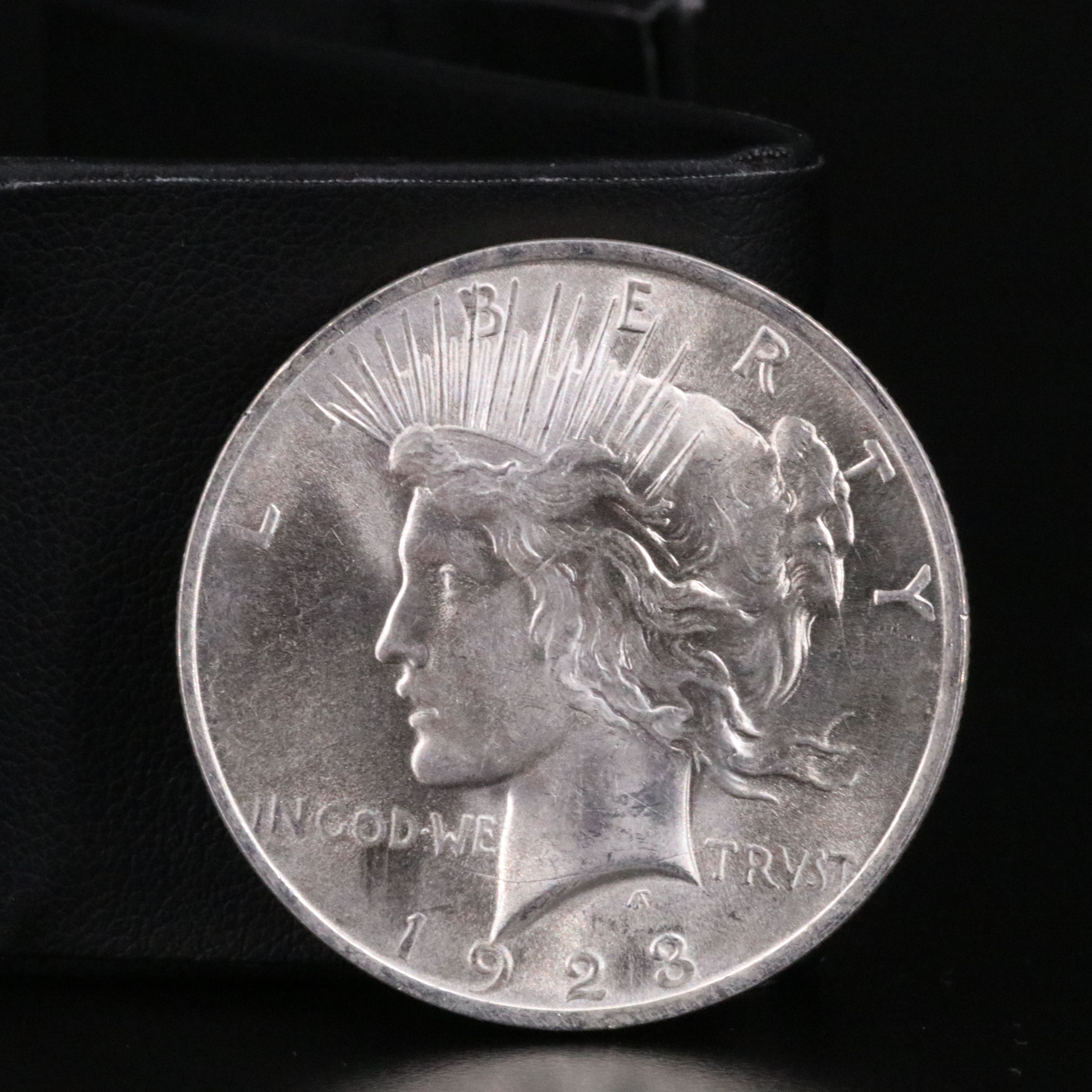 Three Different Uncirculated  U.S. Morgan and Peace Silver Dollars