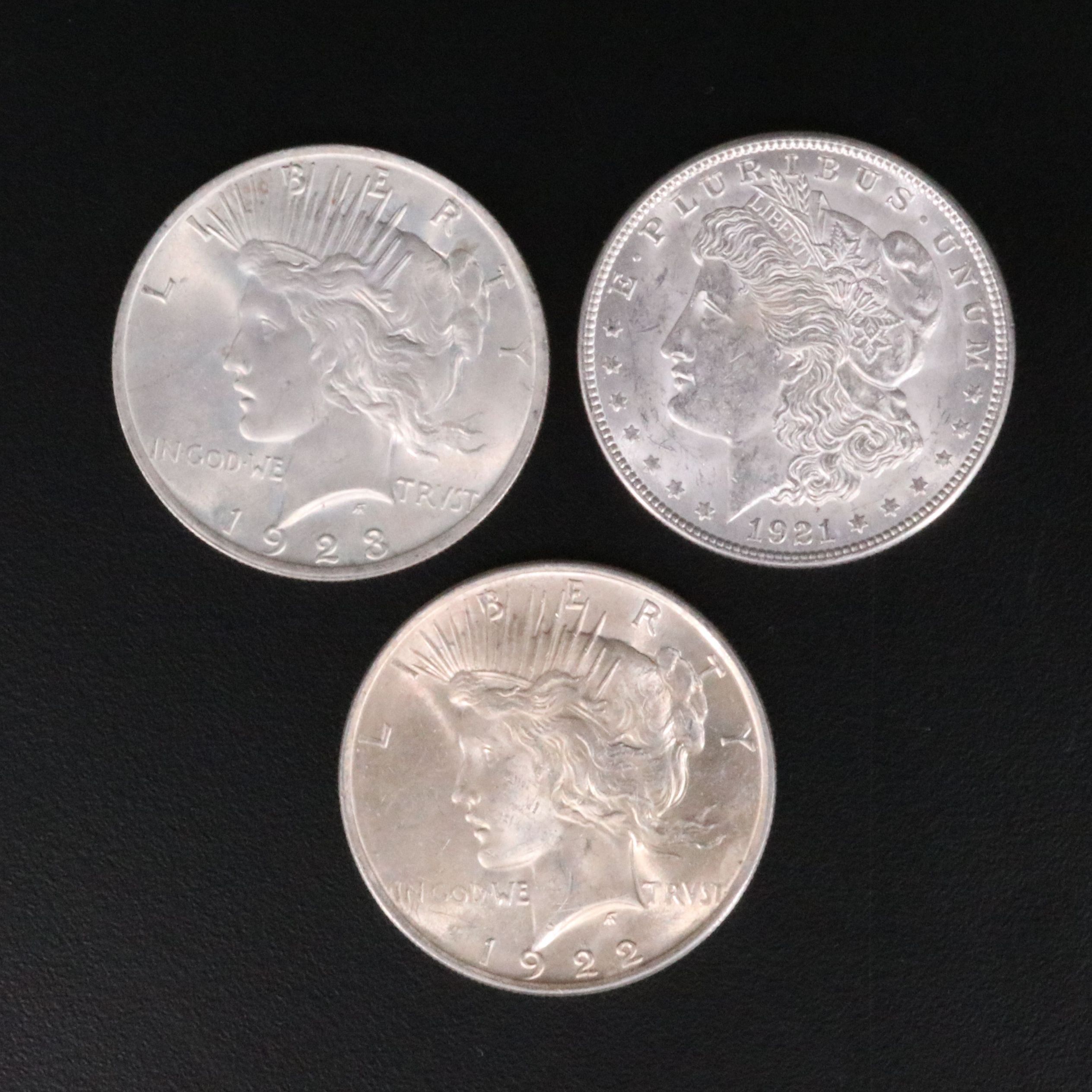 Three Uncirculated  U.S. Morgan and Peace Silver Dollars