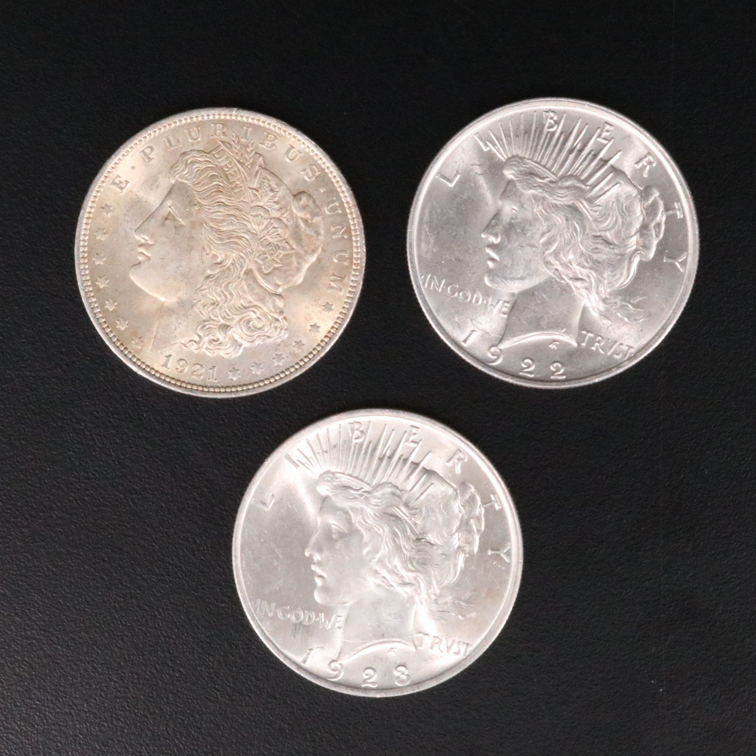 Three Different Uncirculated  U.S. Morgan and Peace Silver Dollars