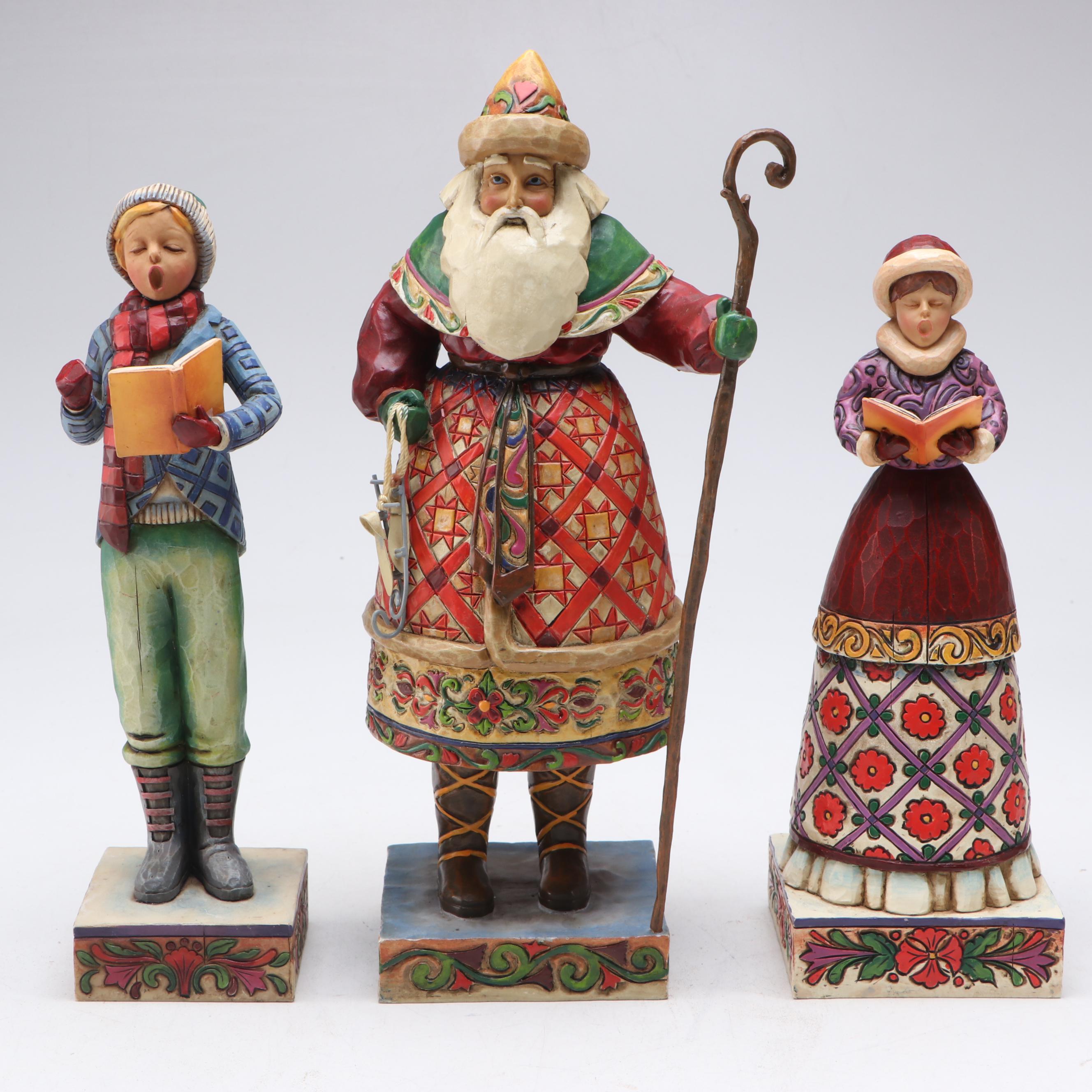 Jim Shore Carolers with Painted Glass Window Panel and Artificial Amaryllises