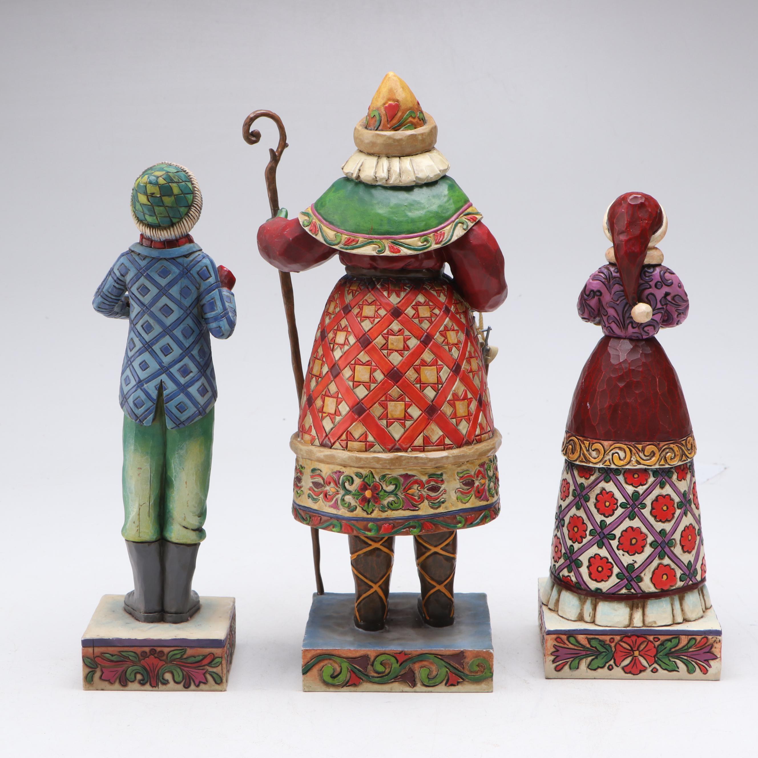 Jim Shore Carolers with Painted Glass Window Panel and Artificial Amaryllises