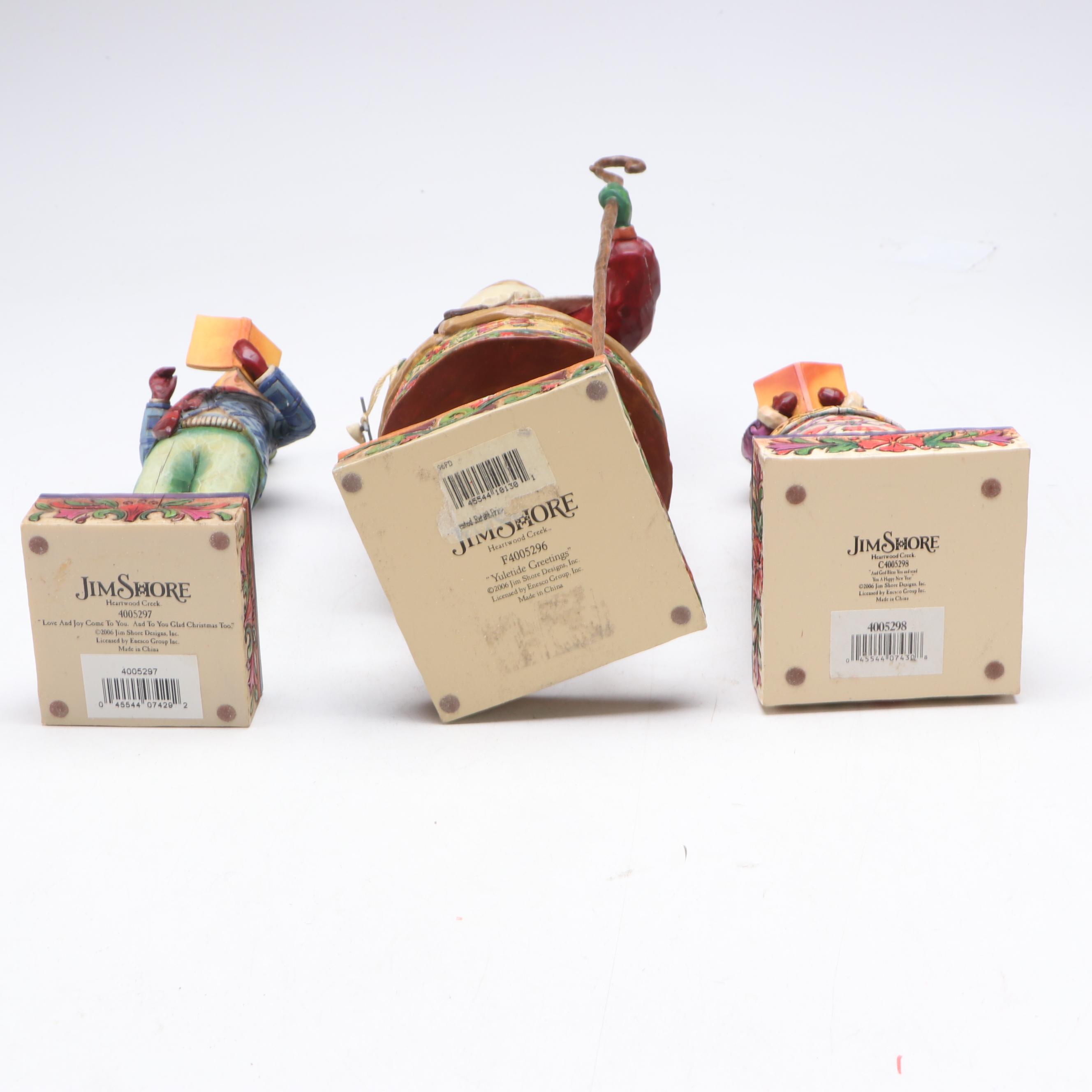 Jim Shore Carolers with Painted Glass Window Panel and Artificial Amaryllises