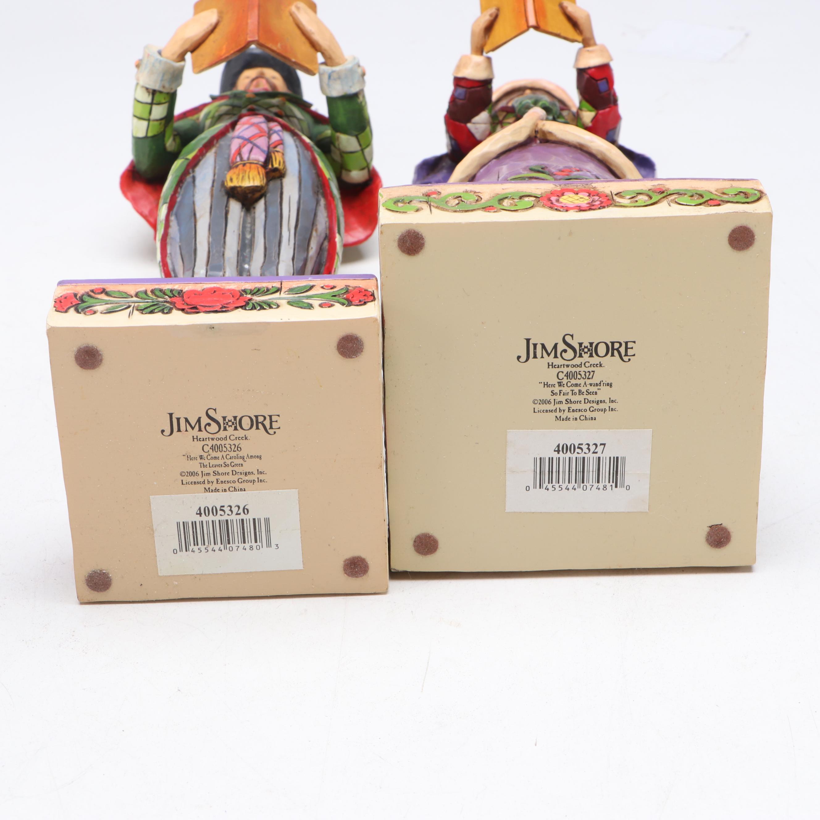 Jim Shore Carolers with Painted Glass Window Panel and Artificial Amaryllises