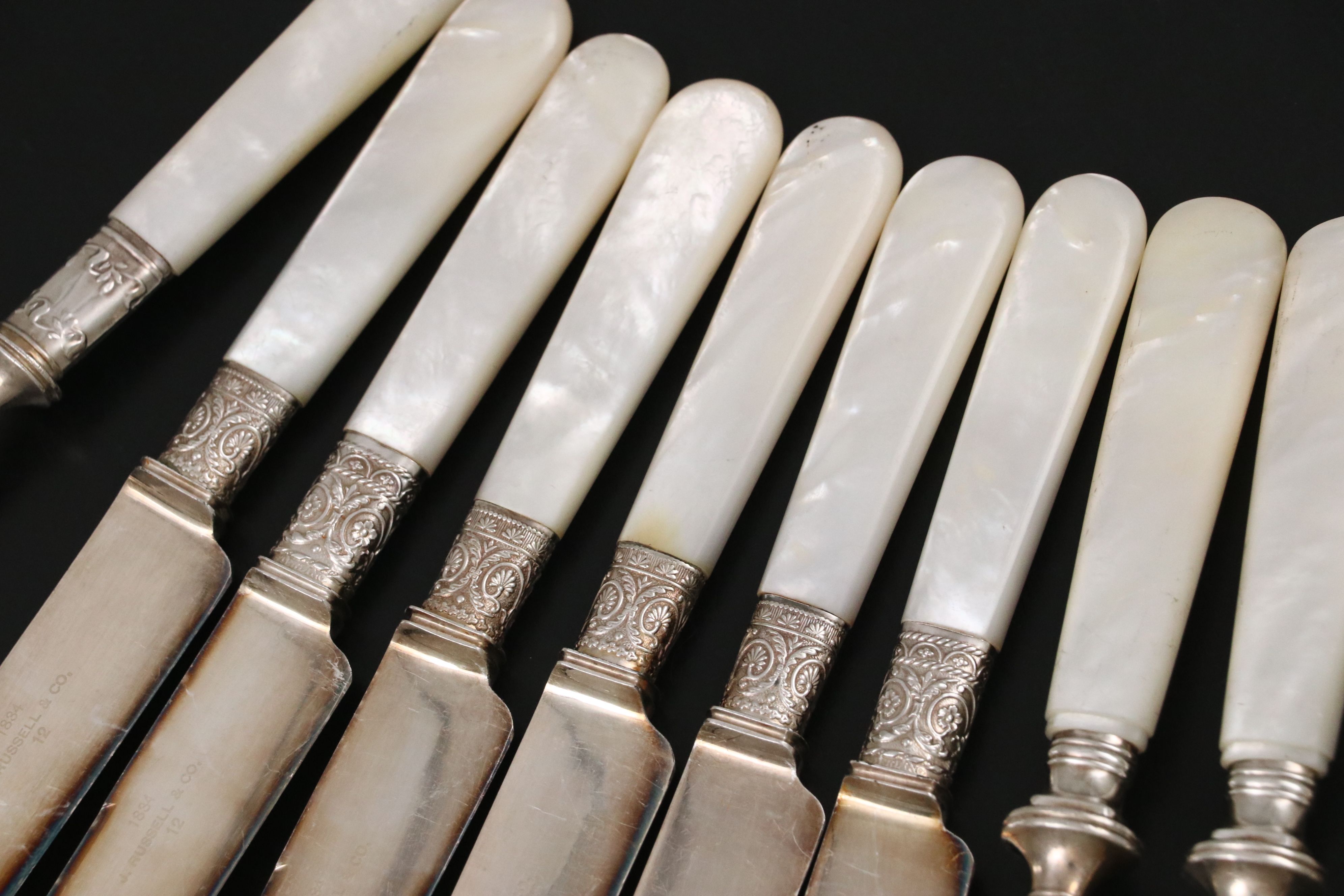 Landers, Frary, & Clark with Other Sterling Ferrule MOP Handled Flatware