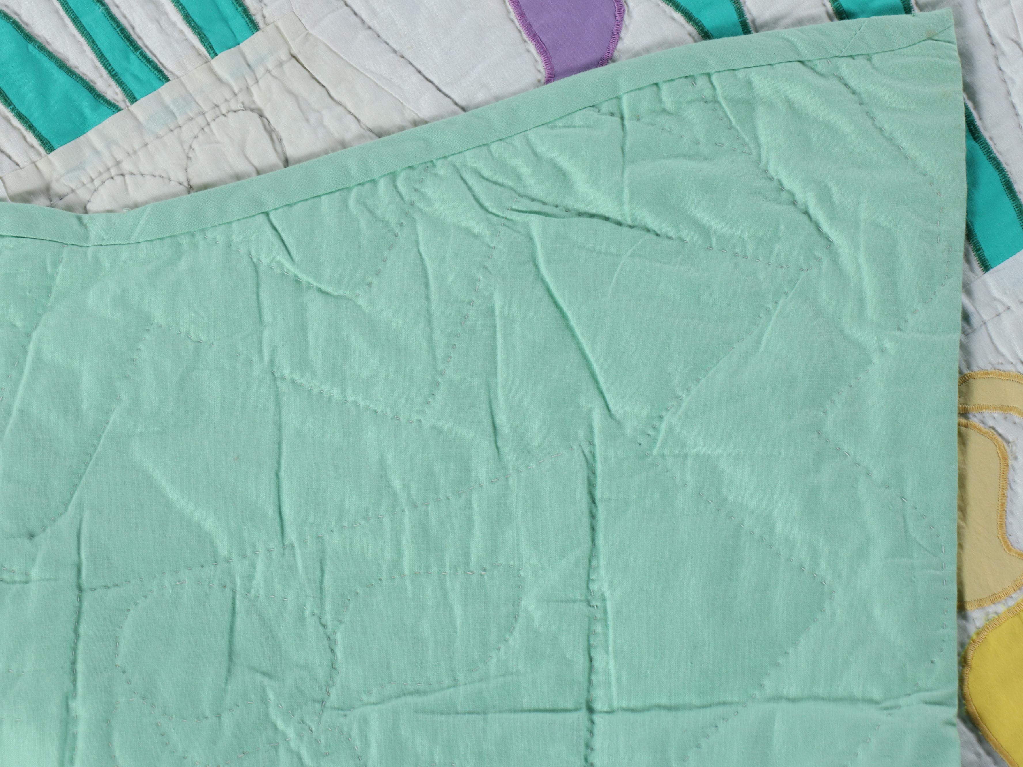 Hand-Pieced "Sunbonnet Sue" and Iris Blooms Appliquéd Quilts