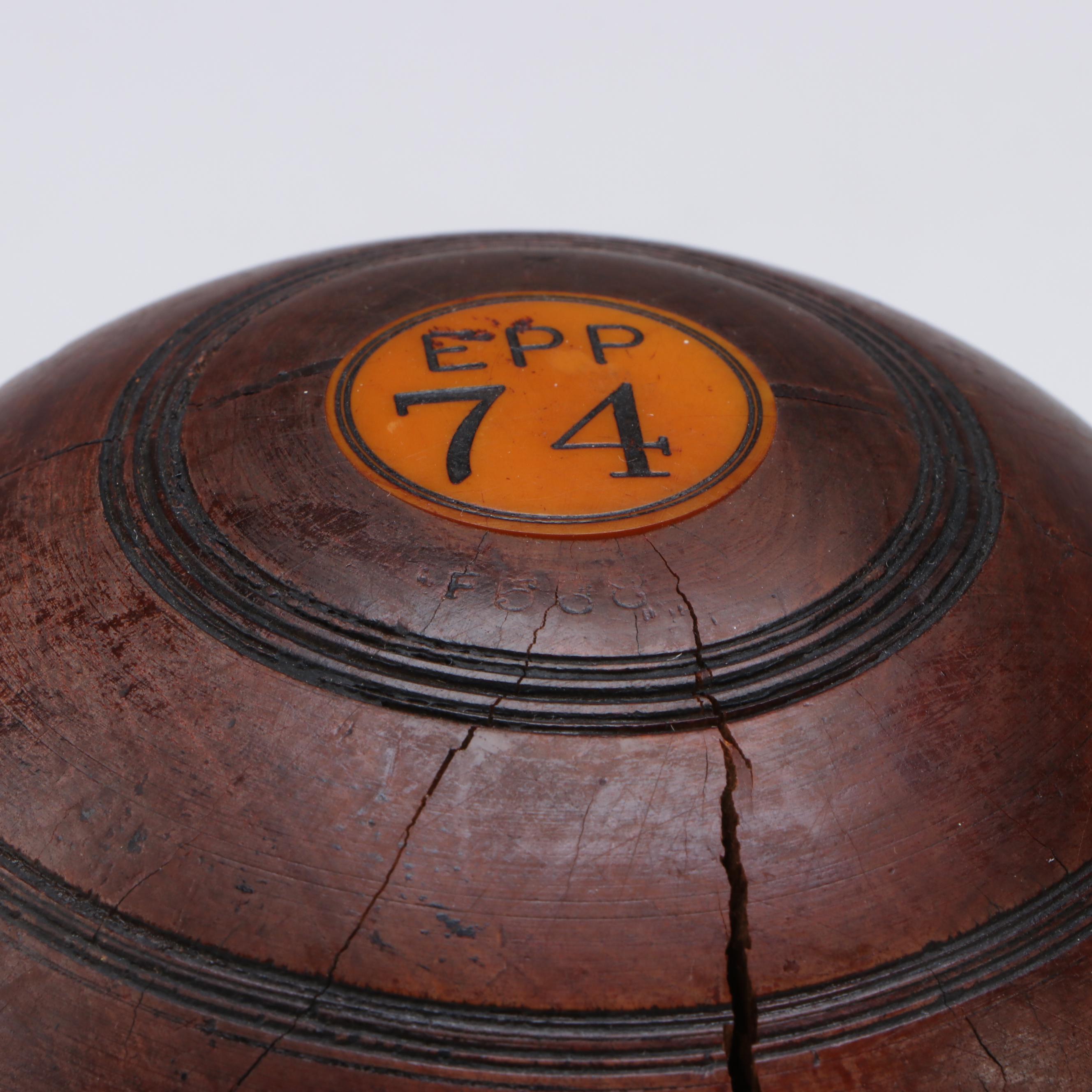 M.T.C. and E.P.P. Carved Lignum Vitae Lawn Bowls with Personalized Discs