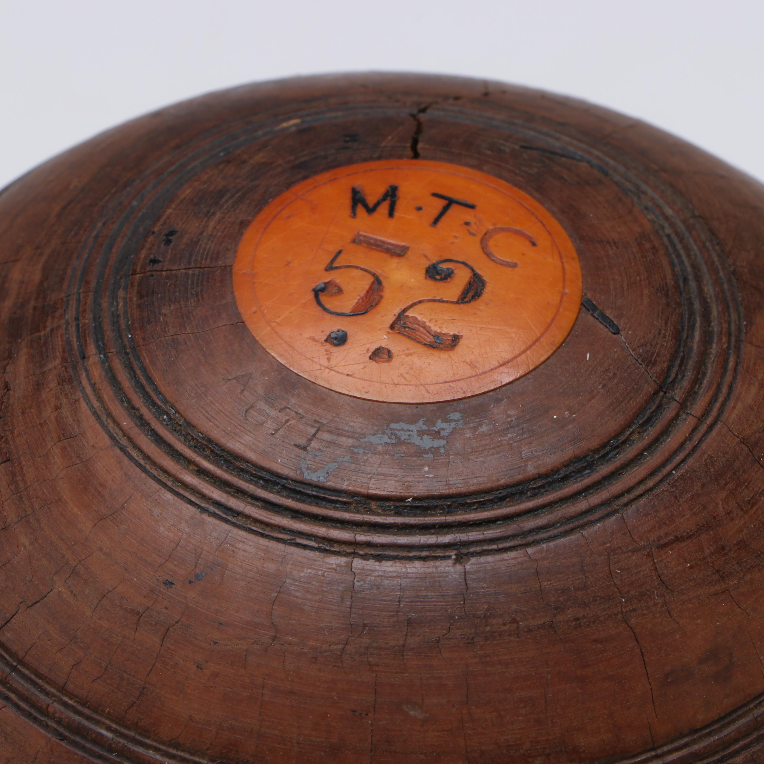M.T.C. and E.P.P. Carved Lignum Vitae Lawn Bowls with Personalized Discs