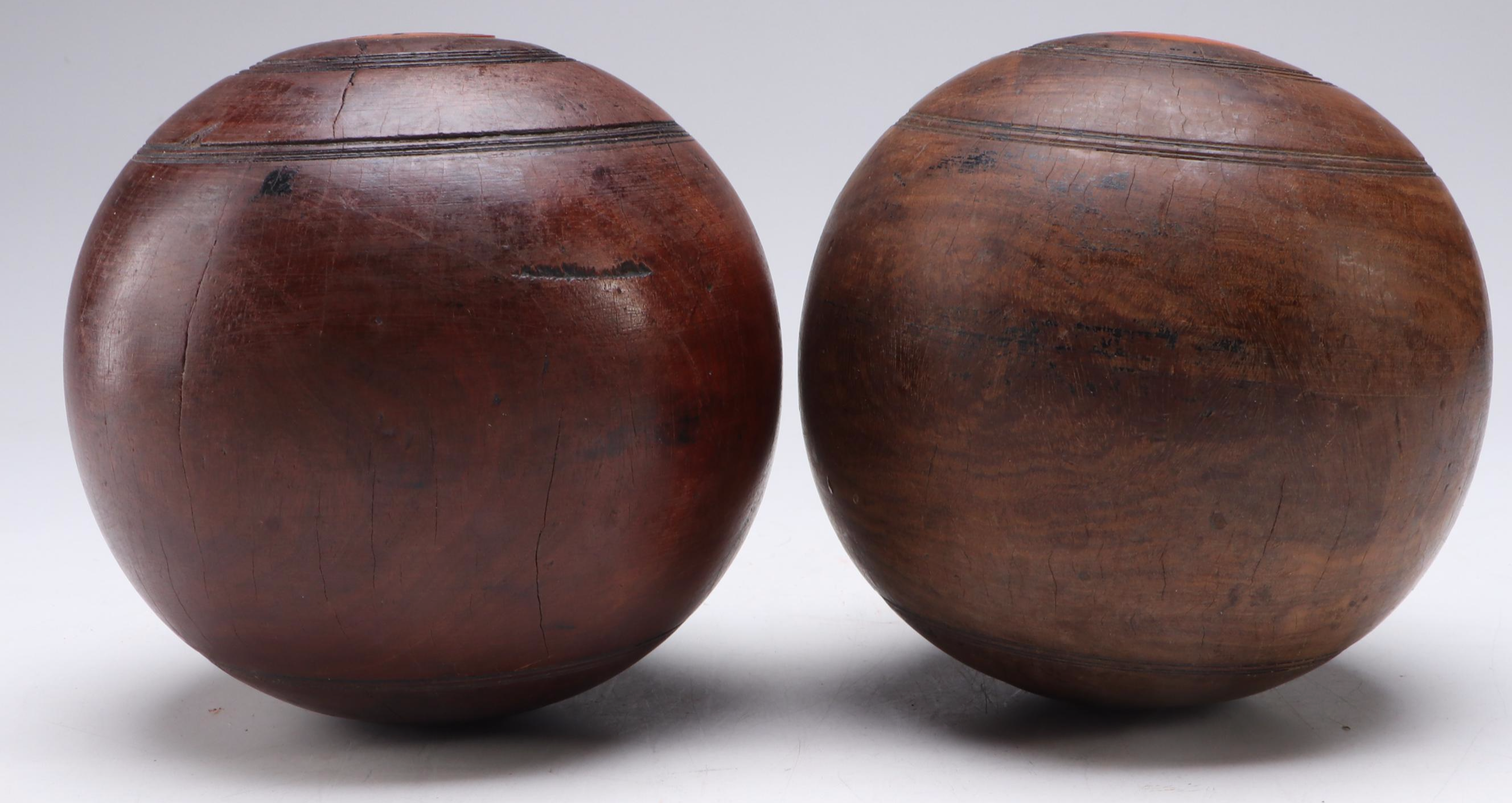 M.T.C. and E.P.P. Carved Lignum Vitae Lawn Bowls with Personalized Discs
