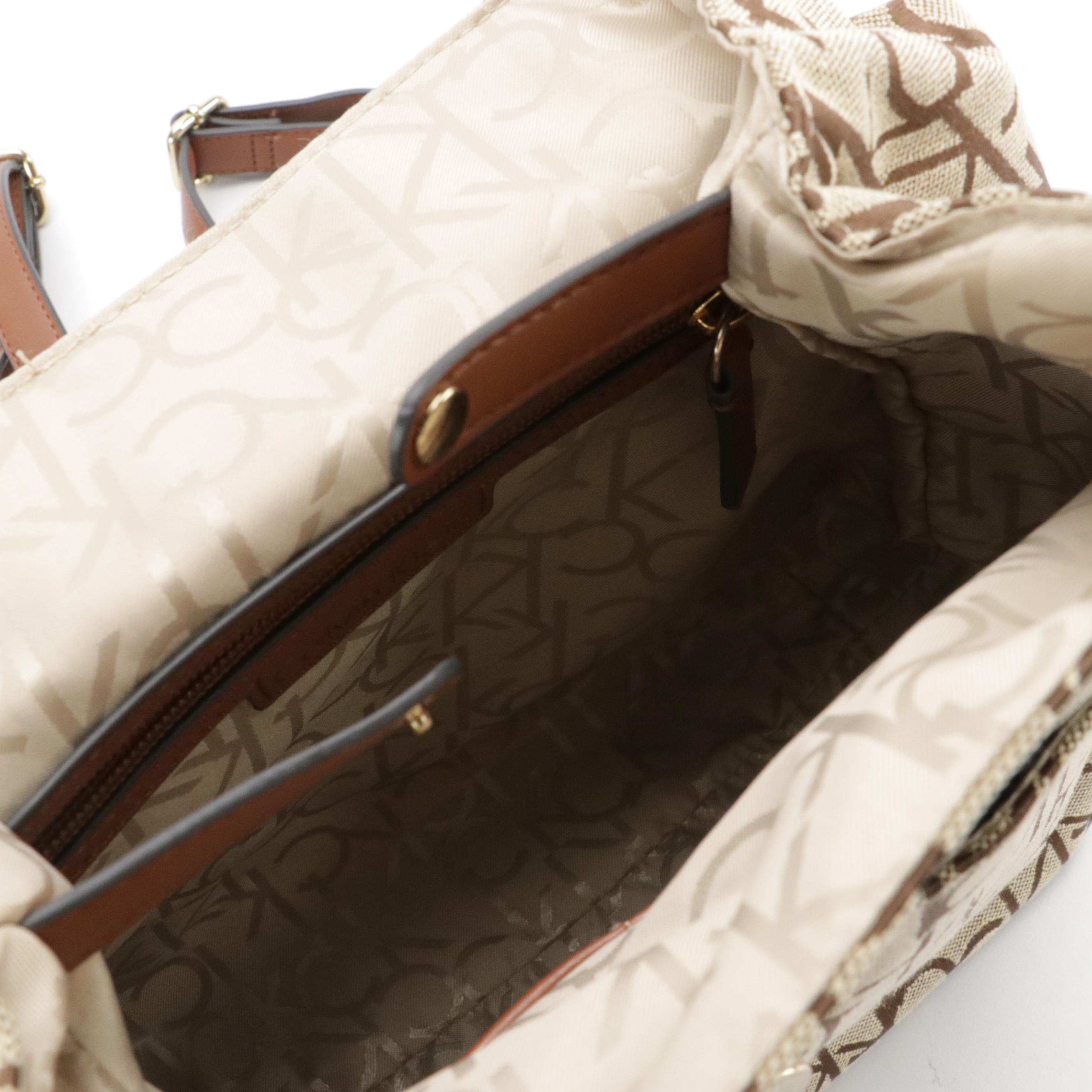 Dooney & Bourke Cooper Hobo Shoulder Bag & Calvin Klein Teodora Canvas Backpack